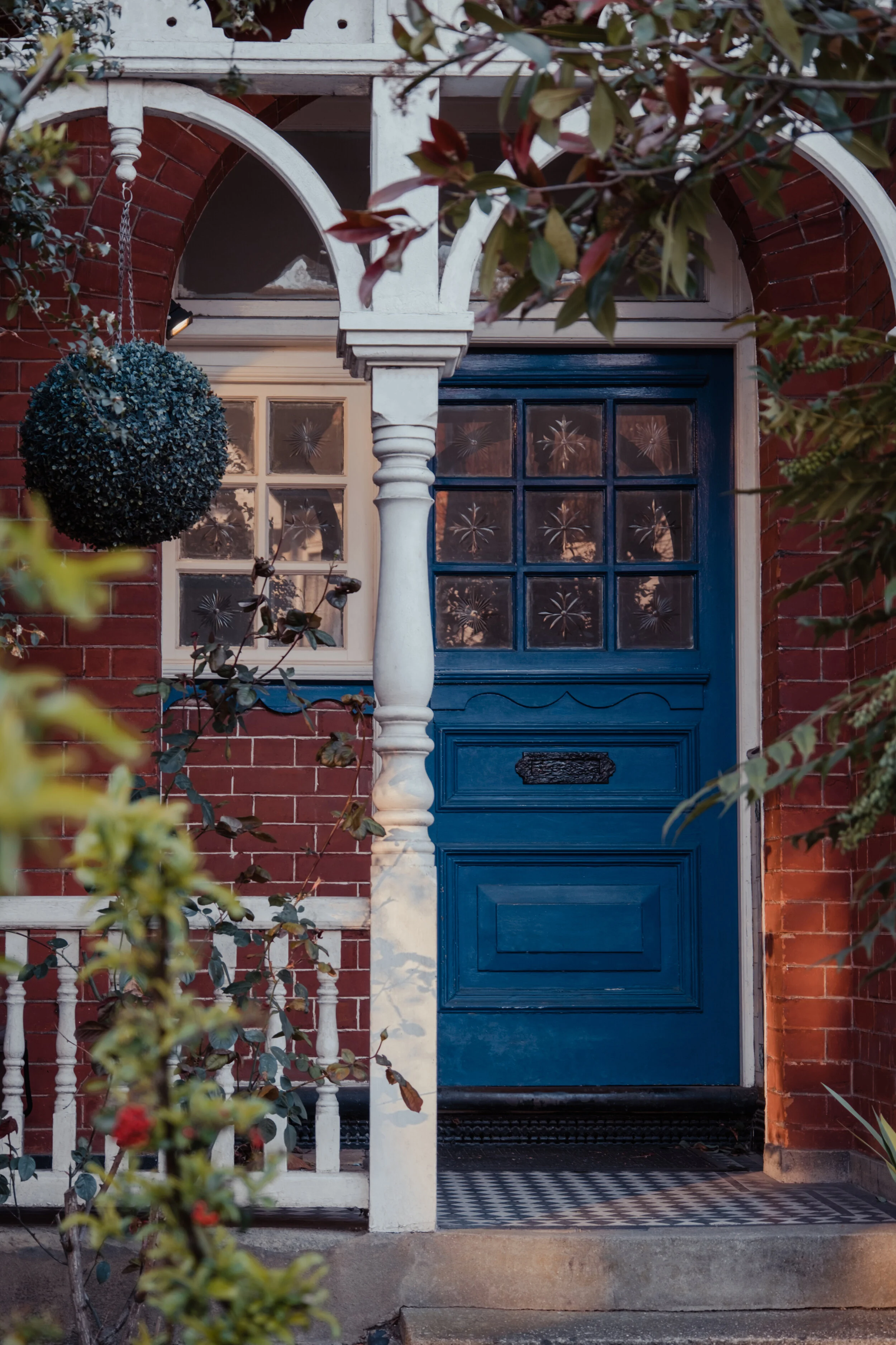 Various loaves of bread balancing on each other.