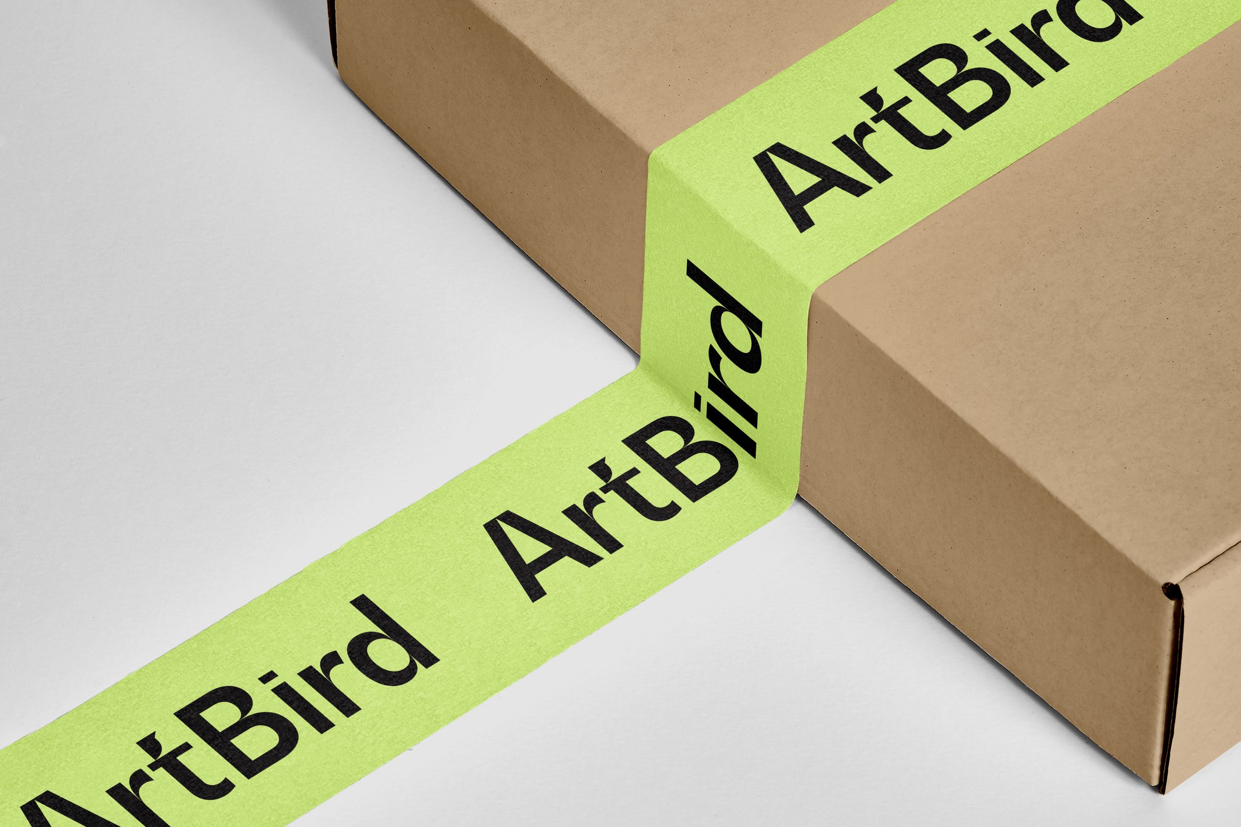 Packing tape with ArtBird logo over cardboard box