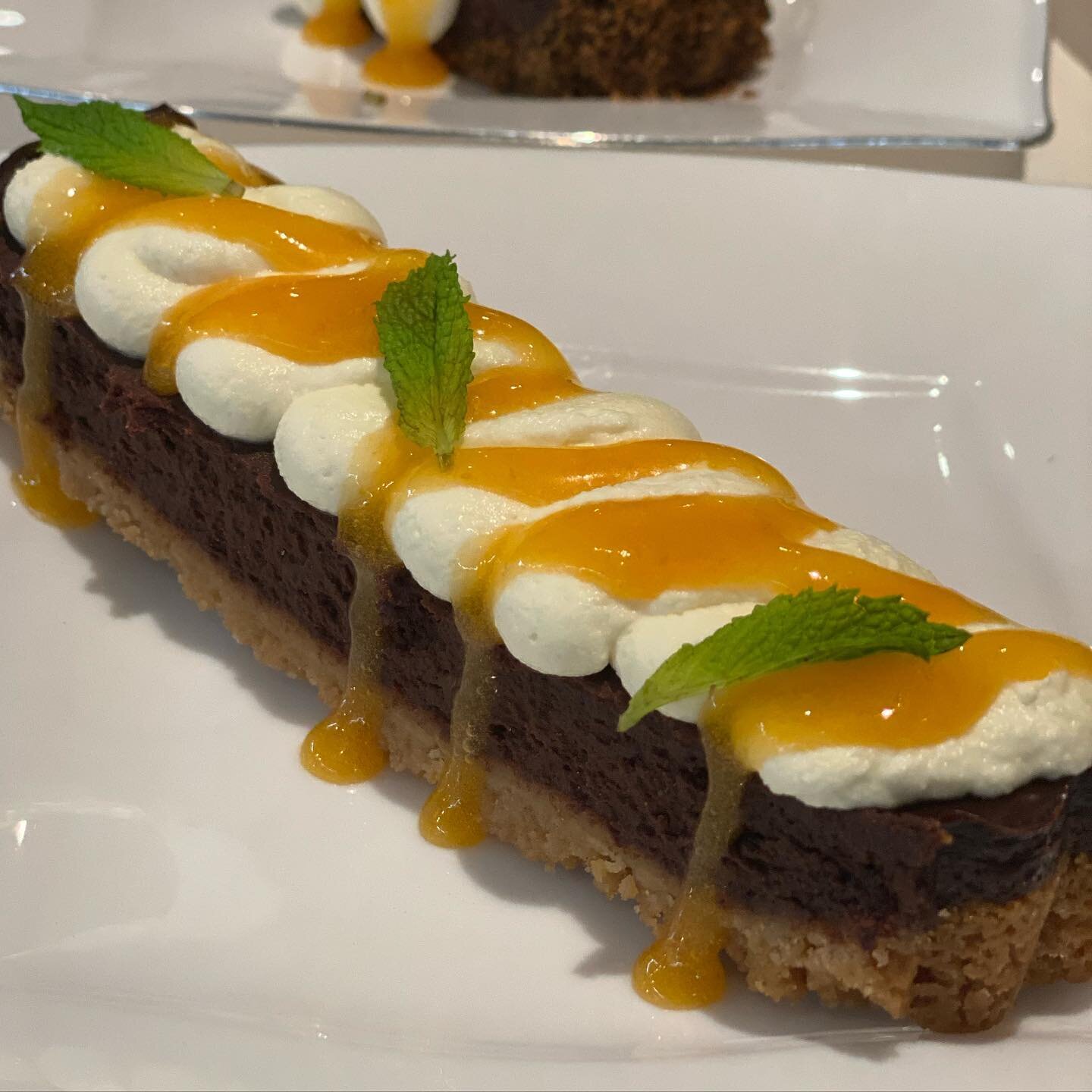 Tart...or art???
Bittersweet chocolate tart with sugar cookie crust, cr&eacute;me fra&icirc;che whipped cream, and apricot coulis!