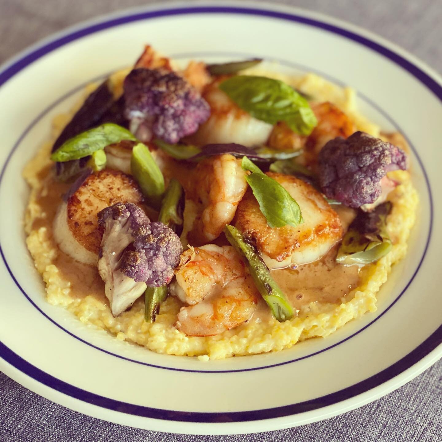 We&rsquo;ve decided that this is a new take on a classic: scallops AND shrimp AND grits! Adorned with grilled Romano beans, purple cauliflower, and a hard cider sauce, this is the perfect market meal to welcome Summer.
