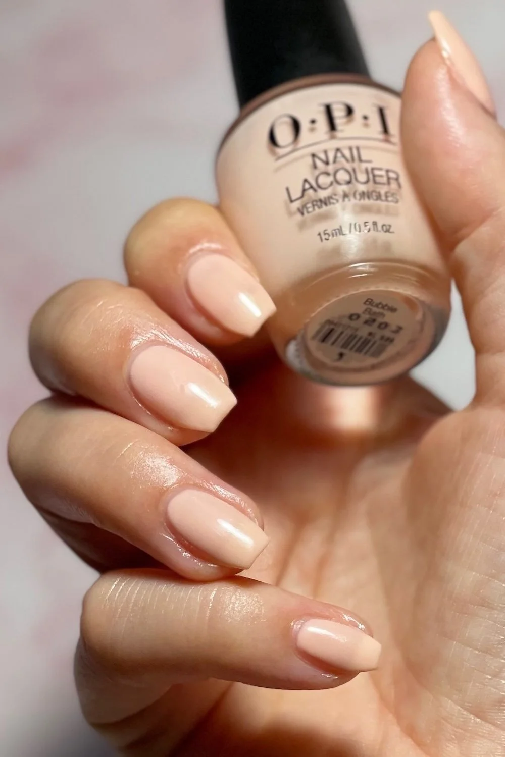 OPI Bubble Bath swatch holding bottle