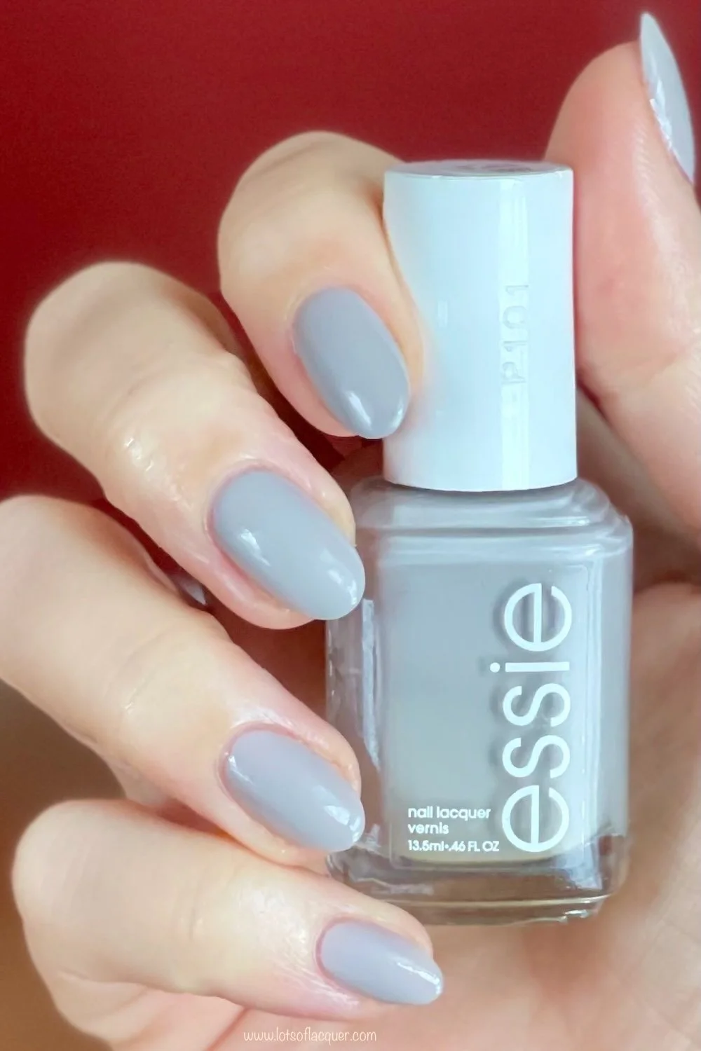 essie without a stitch swatch holding bottle