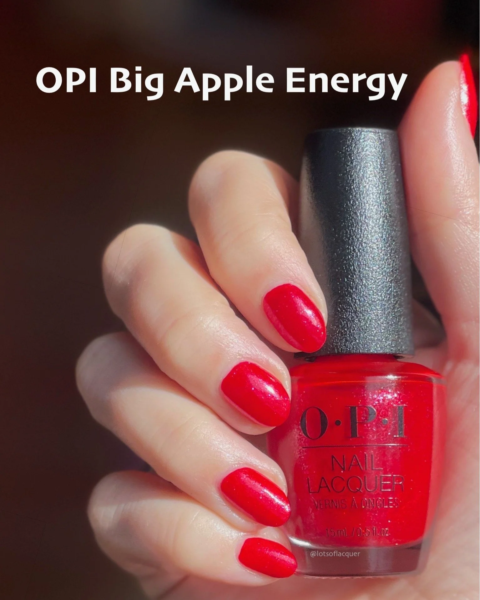 Gifted by @beyondpolish ✨🍎 Meet @opi Big Apple Energy! Shown in 2 coats, this is a remix of Big Apple Red - which is a classic bright red creme. Big Apple Energy retains the bright, bold red undertones but it includes a pink to purple sparkle, that 