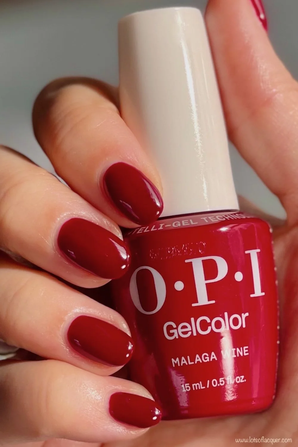 Shade gifted by Beyond Polish - OPI GelColor Malaga Wine swatch w bottle in hand