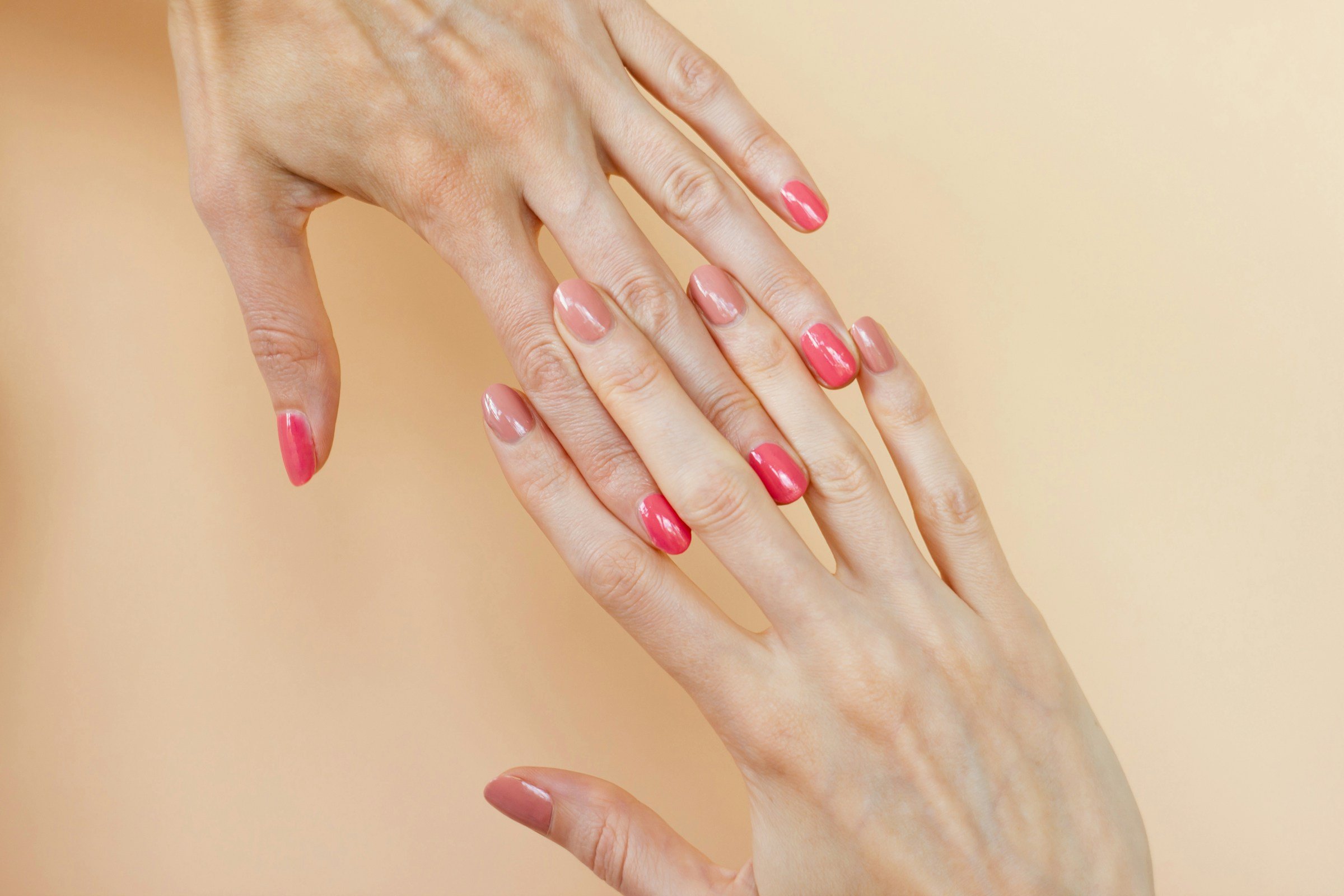 Peach and nude nails by Maria Lupan on Unsplash