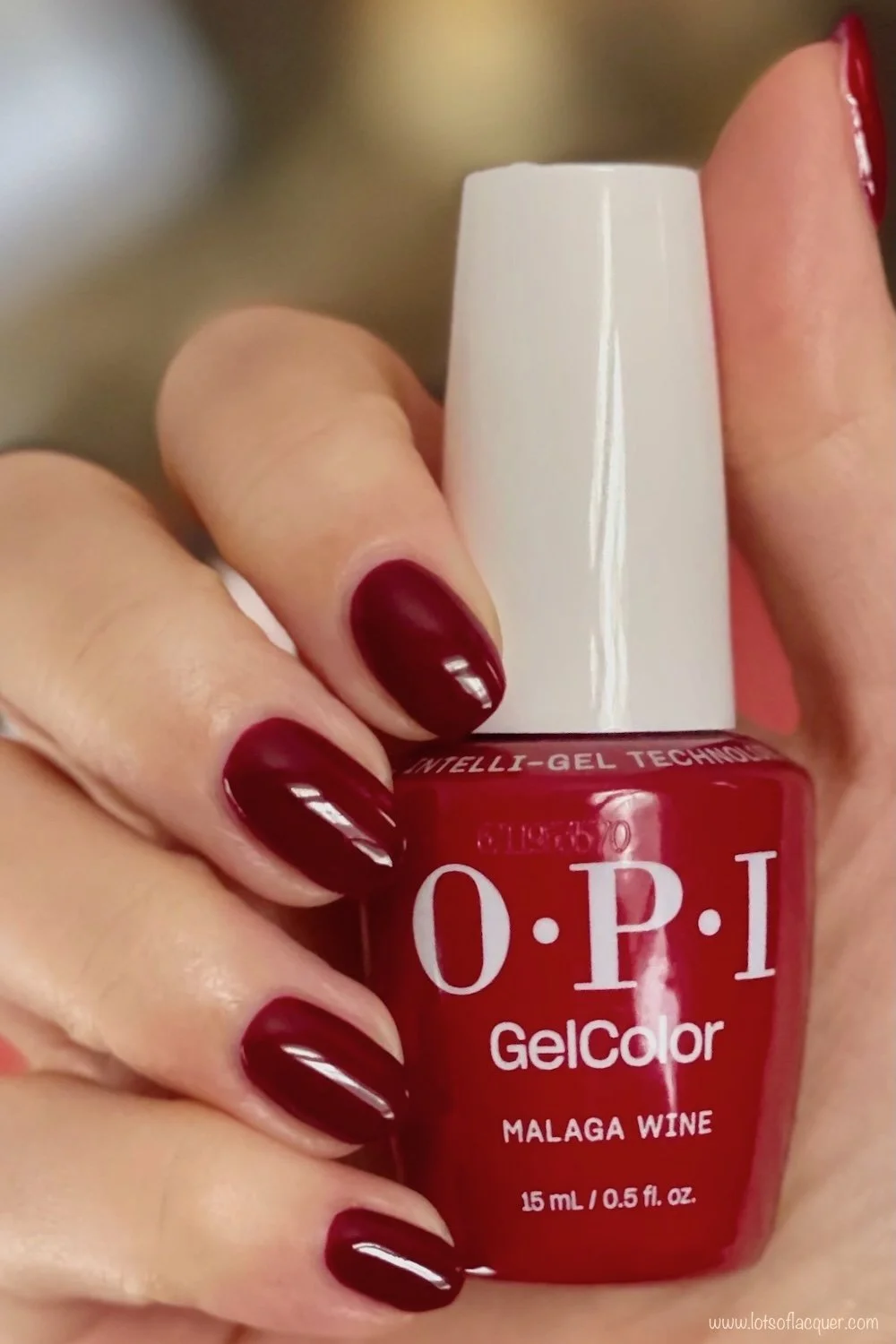 Shade gifted by Beyond Polish - OPI GelColor Malaga Wine swatch w bottle in hand