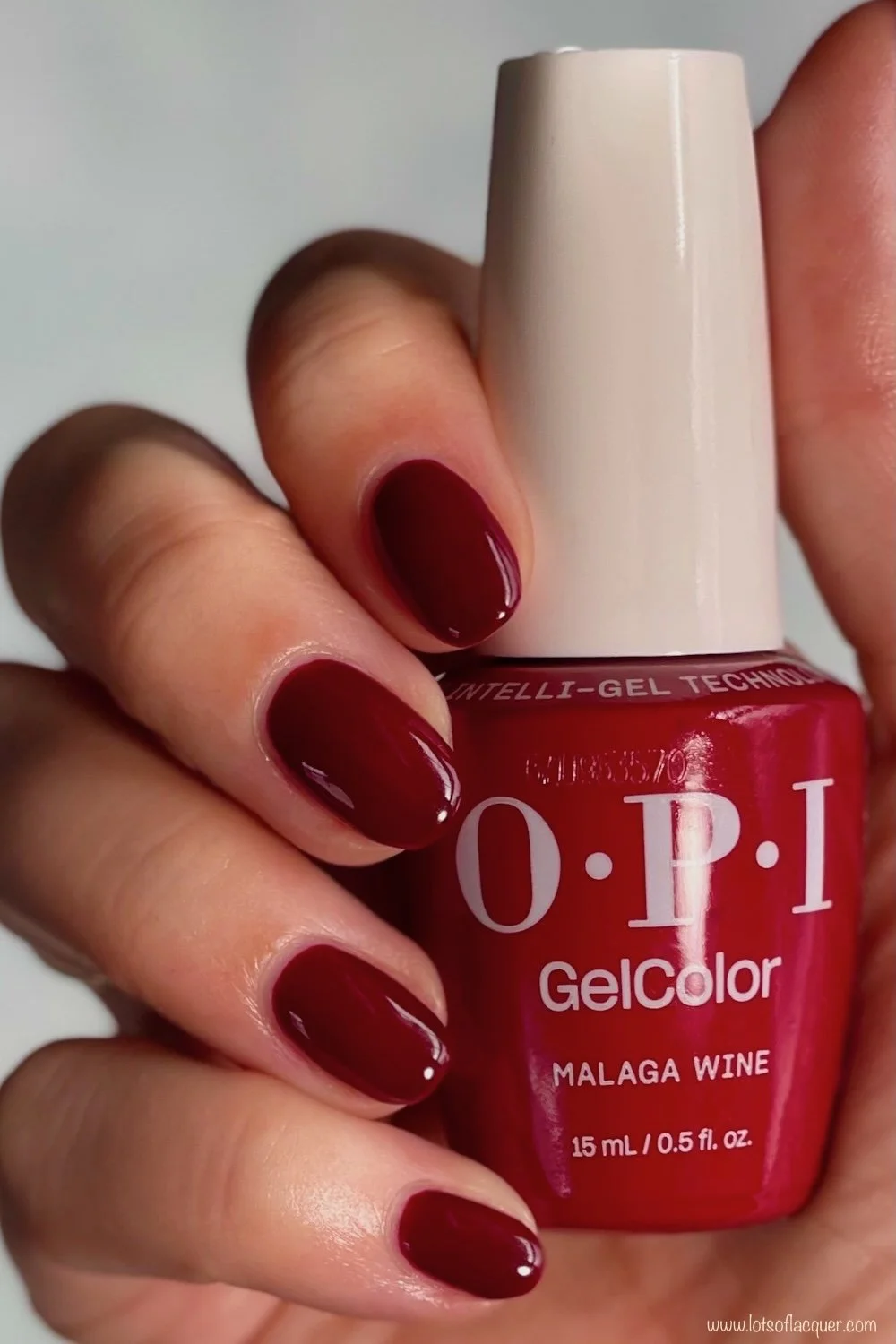 Shade gifted by Beyond Polish - OPI GelColor Malaga Wine swatch w bottle in hand