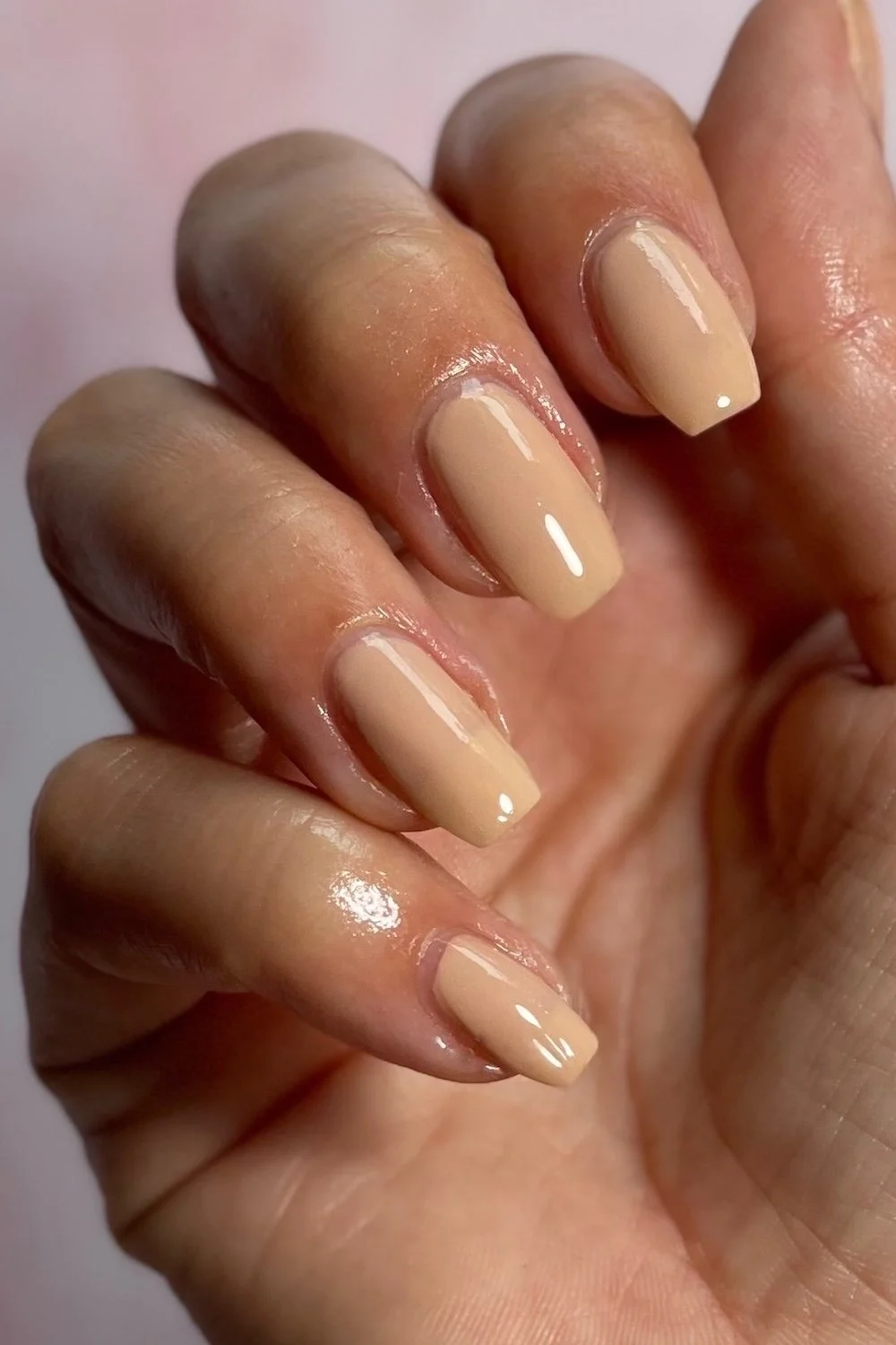 OPI Samoan Sand swatch holding bottle