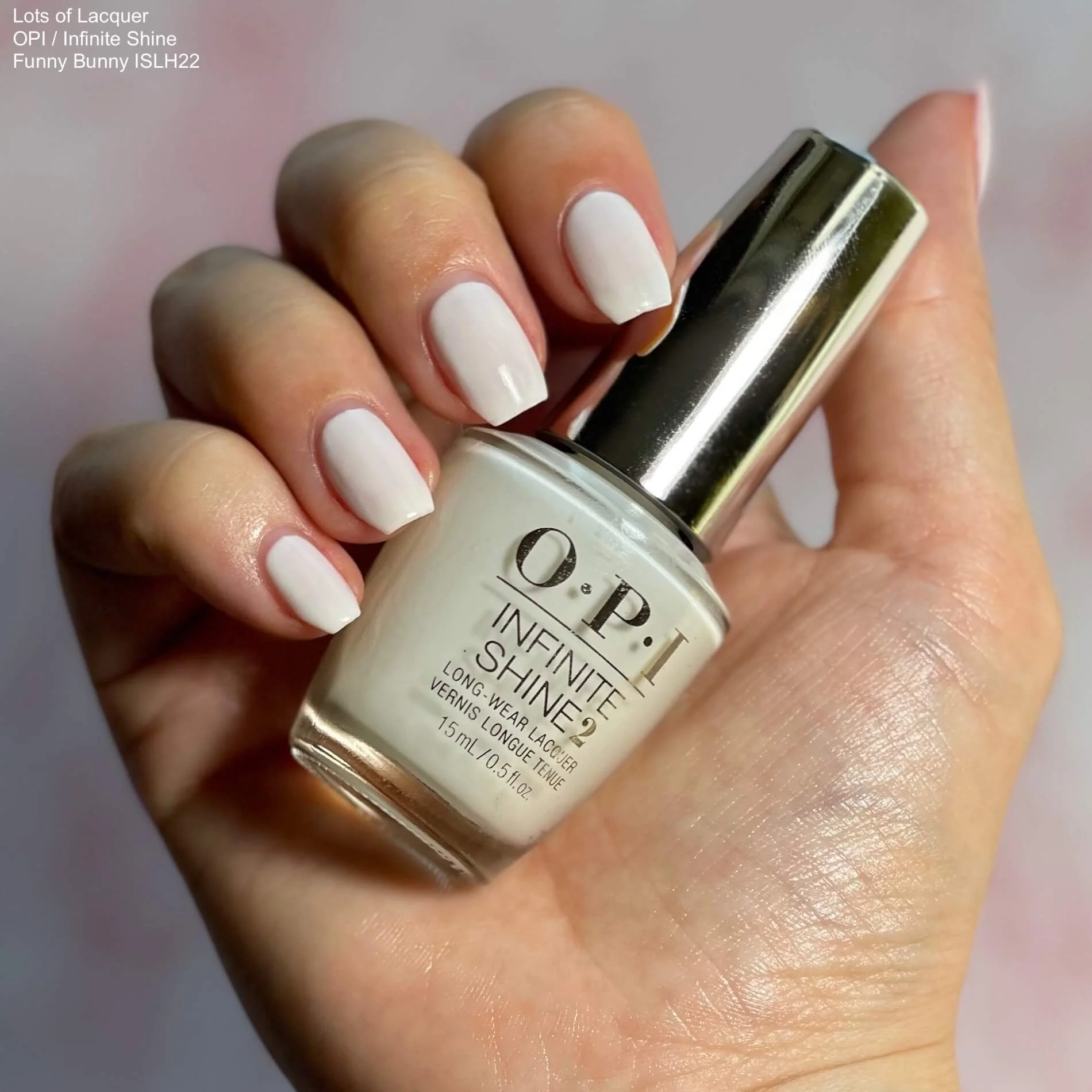 OPI Infinite Shine Funny Bunny swatch with bottle in hand