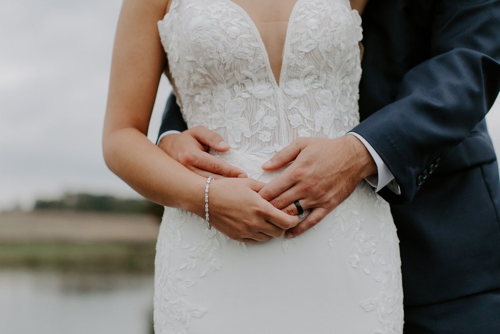 Couple embraces holding hands during Lancaster, Pennsylvania wedding