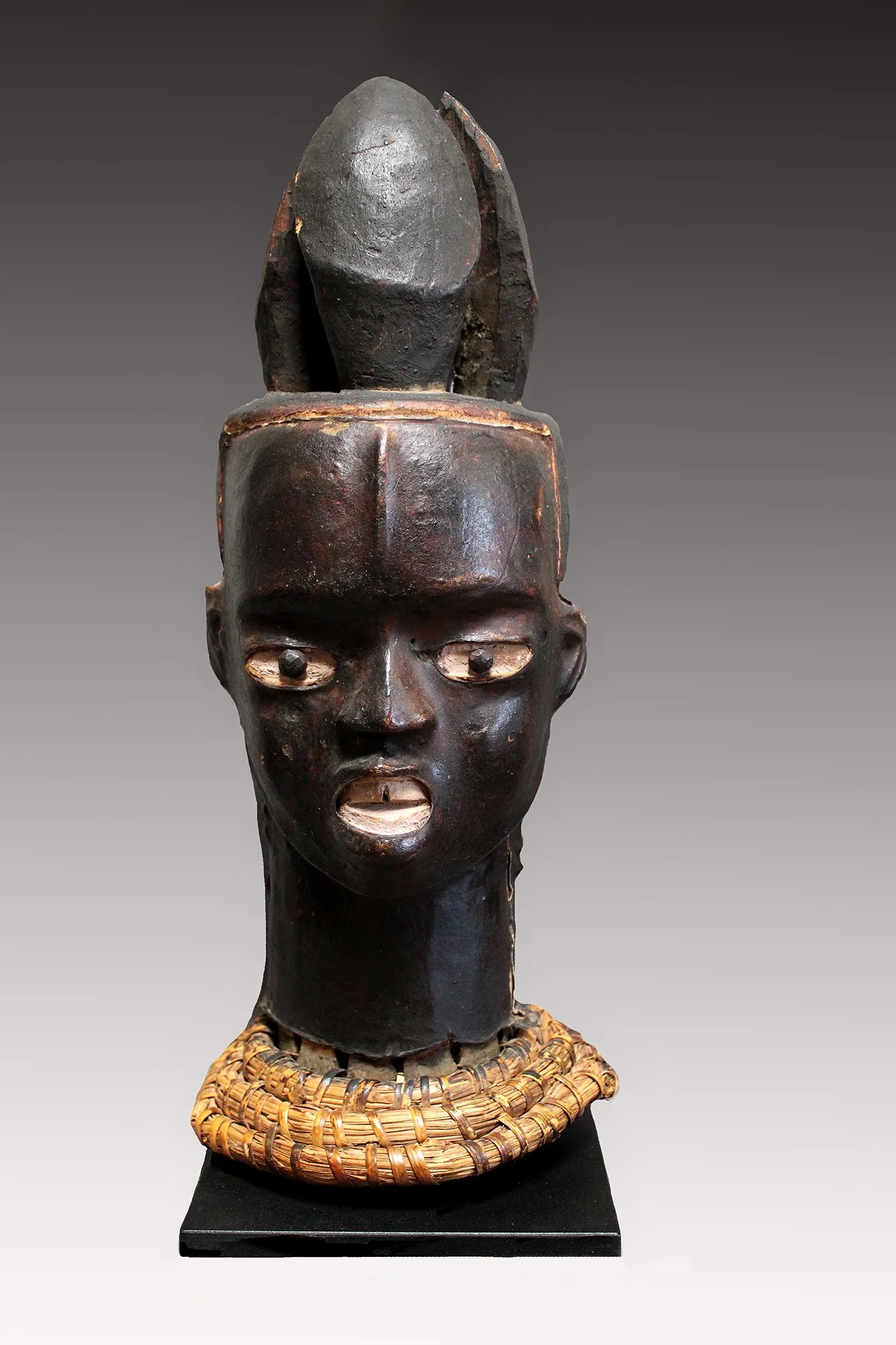 Ekoi antelope skin covered cap masks  mounted on a basketry pedestal.  www.gallerytribalart.com