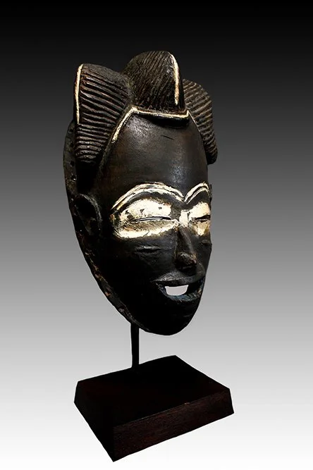 Bete arched brows, linear nose and elliptical eye slits.  www.intriguegallery.com