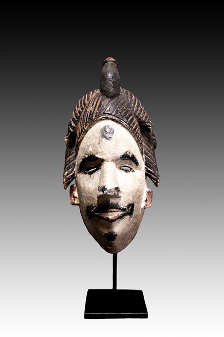 Igbo mask oval shaped face with slit eyes.  www.intriguegallery.com
