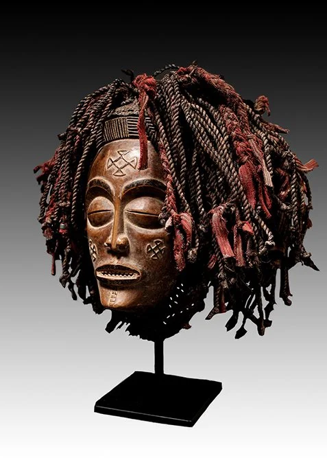Chokwe mask has raised scarification of the Portuguese cross.  www.intriguegallery.com