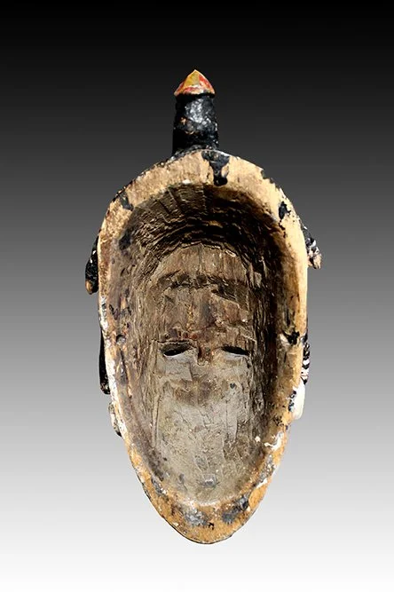 Ibo mask with old dry wood and adze marks.  www.intriguegallery.com