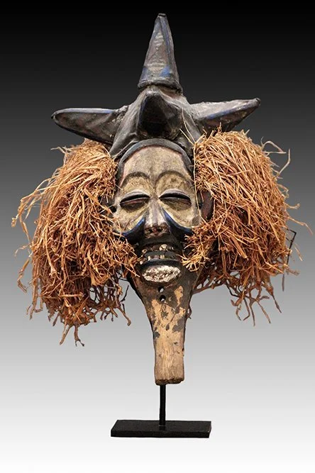 Yaka mask, the headdress is woven fiber with five raised cone forms.  www.intriguegallery.com