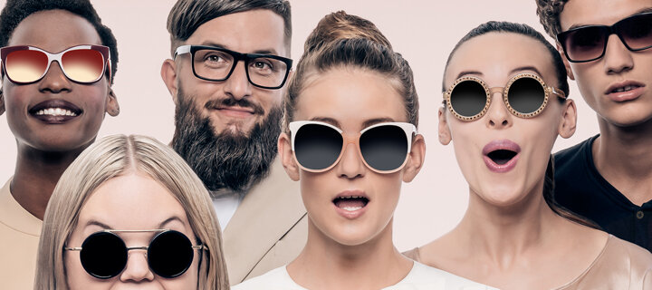 Portrait of six, young and attractive men and women wearing eyeglasses and sunglasses with a variety of happy expressions on their faces