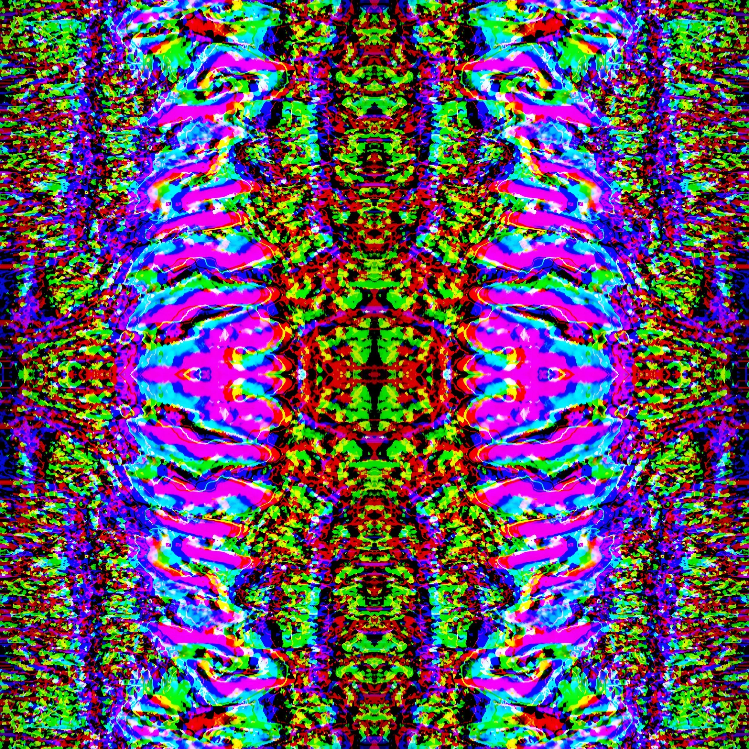 Square mirrored kaleidoscope of magenta and cyan ribbed bands on speckled green and red — "No. 052 — The Static Rosary" by Michael Siani
