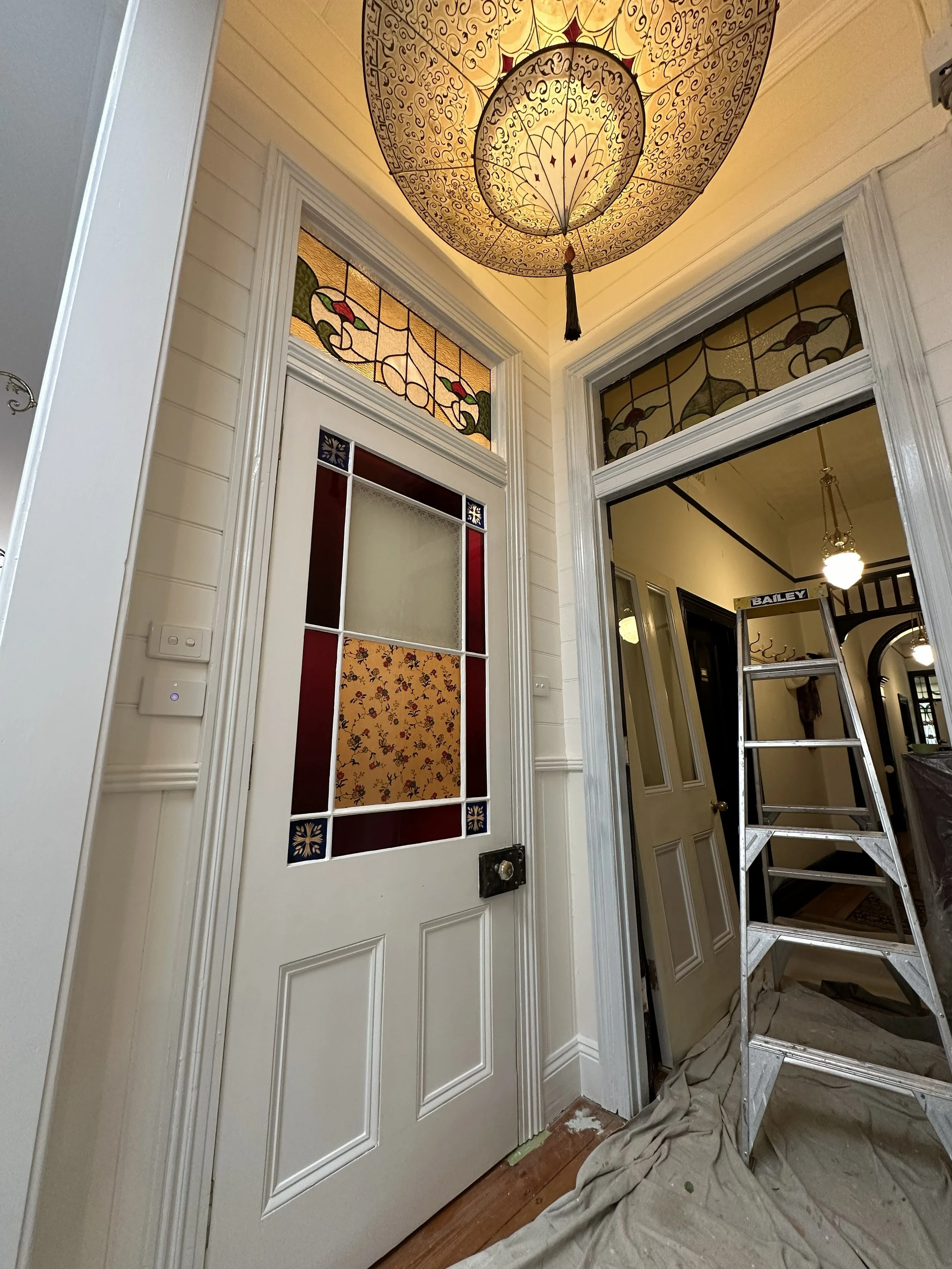 Interior hallway repaint with repaired plaster, clean edges, and bright, even finish