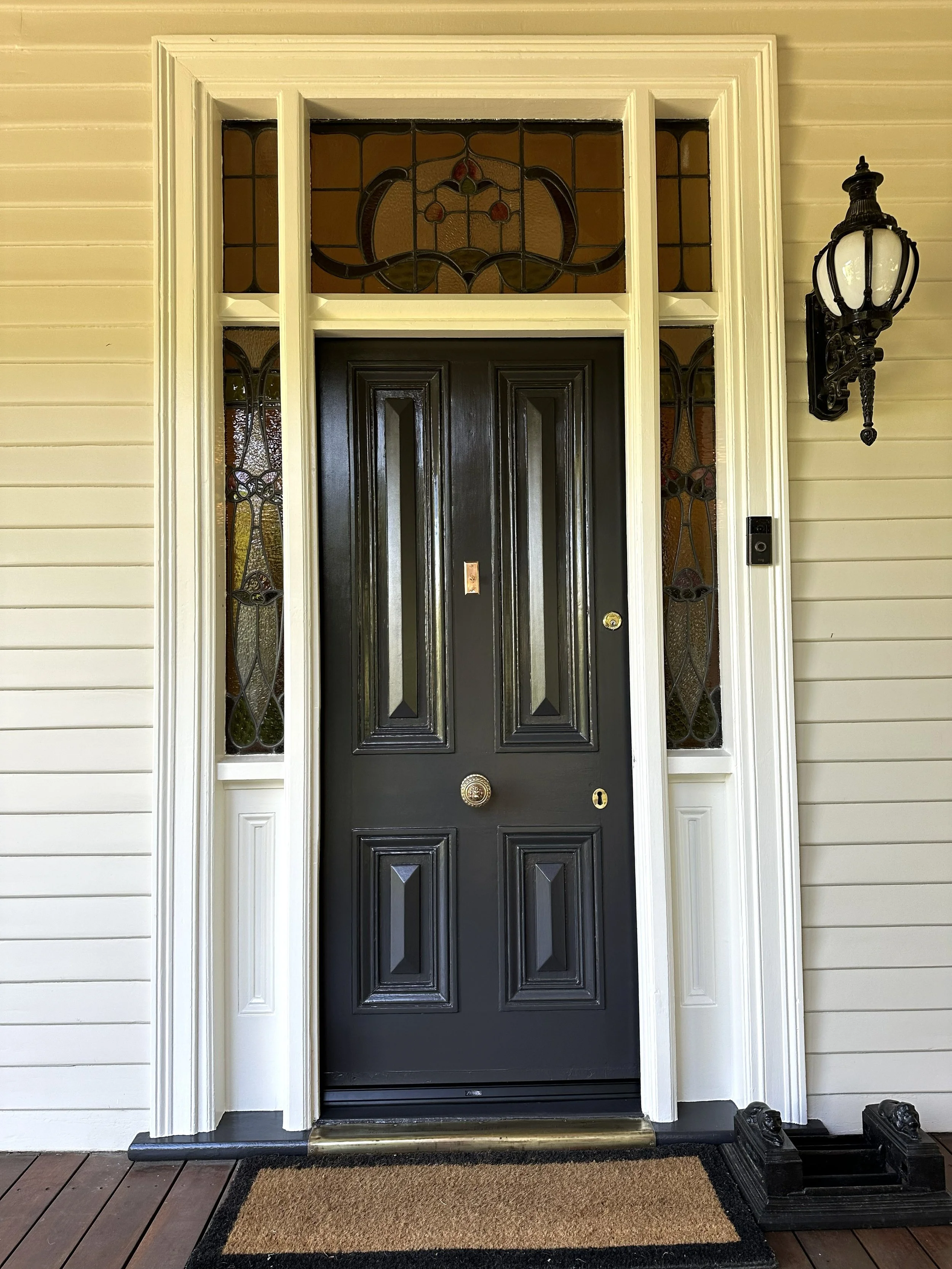 Restored 165‑year‑old front door with repaired timber and premium gloss repaint.