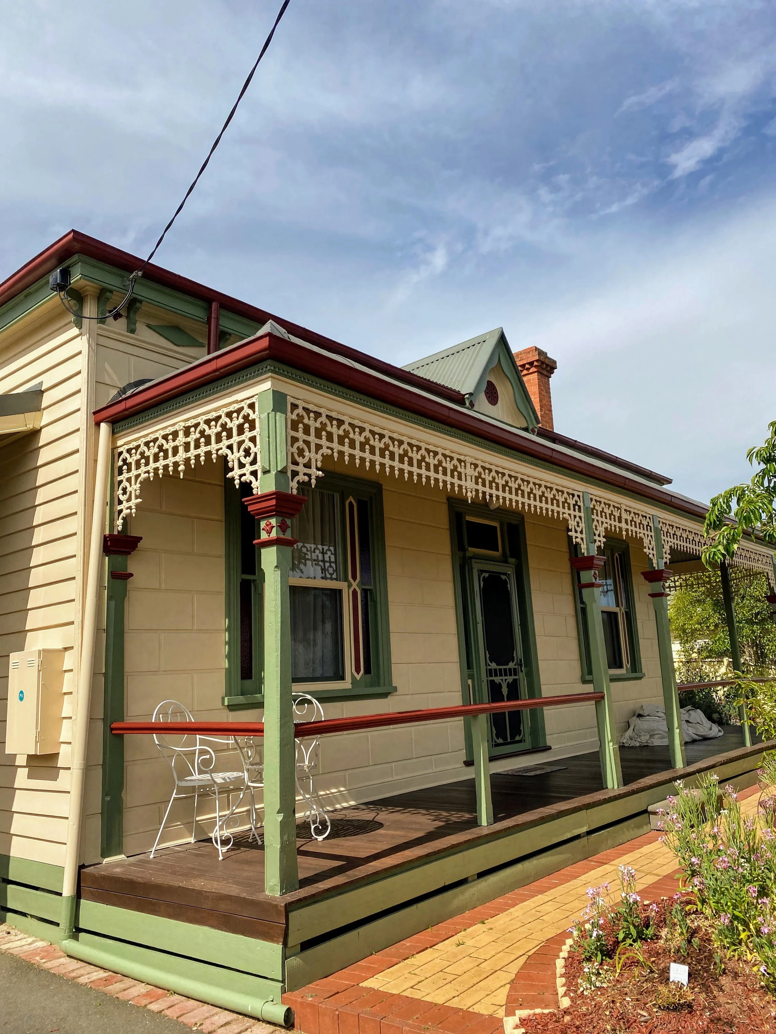 Front façade repaint on a Glen Iris weatherboard home with restored trims and windows.