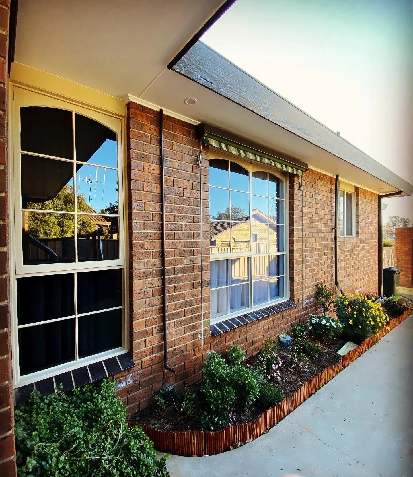 Classic cream window repaint with restored putty lines and clean timber detailing.