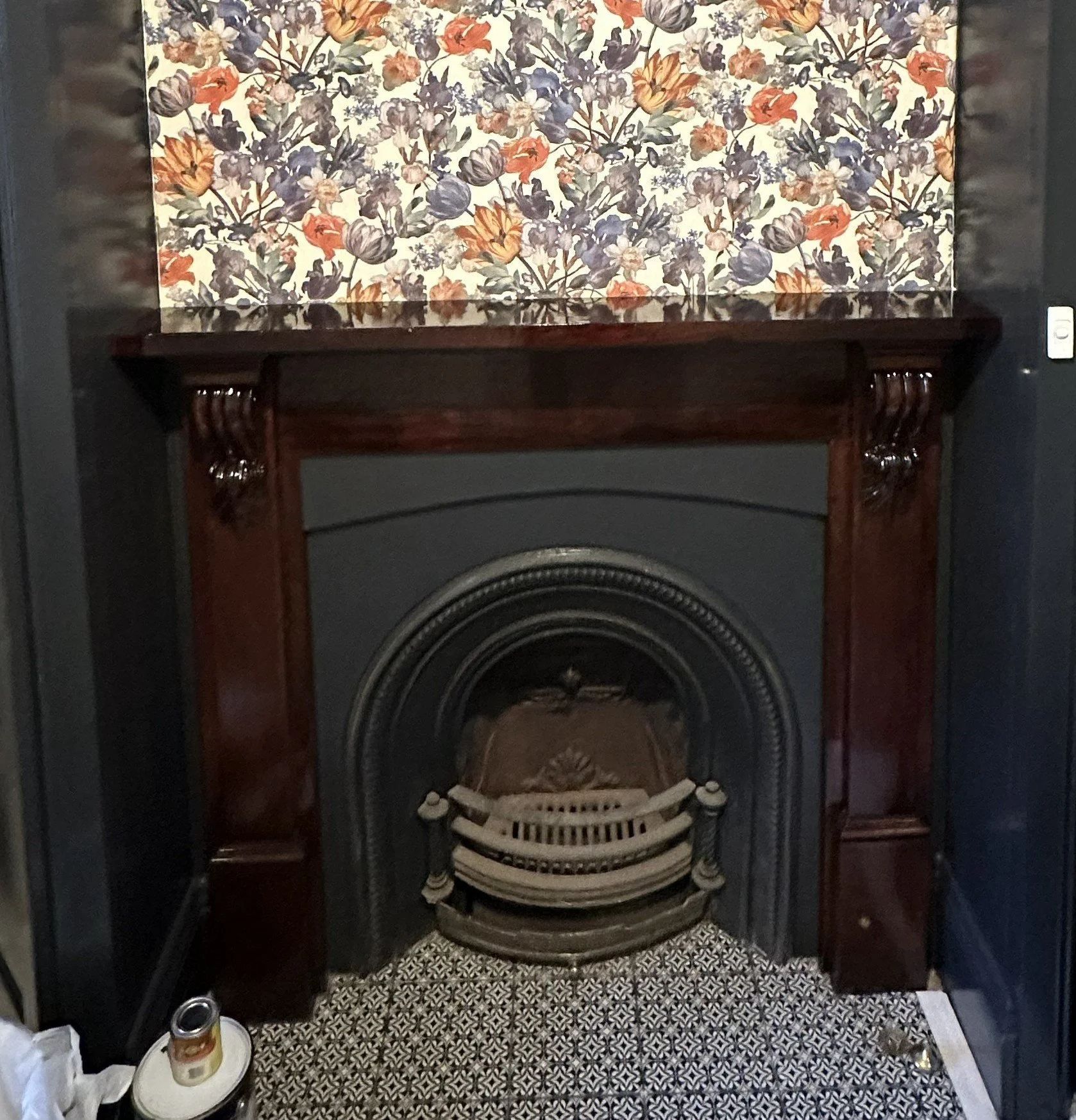 After photo showing restored fireplace surround with clean, modern finish