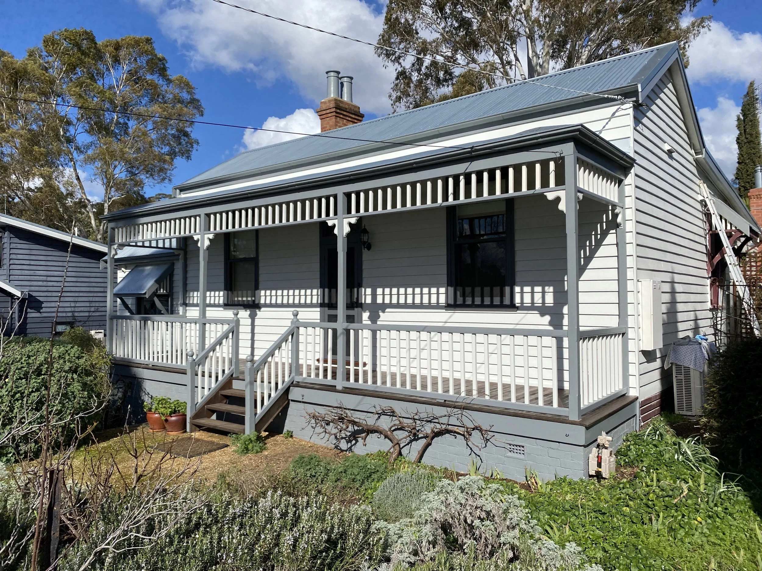 Full exterior repaint on a classic weatherboard home with smooth, even finish