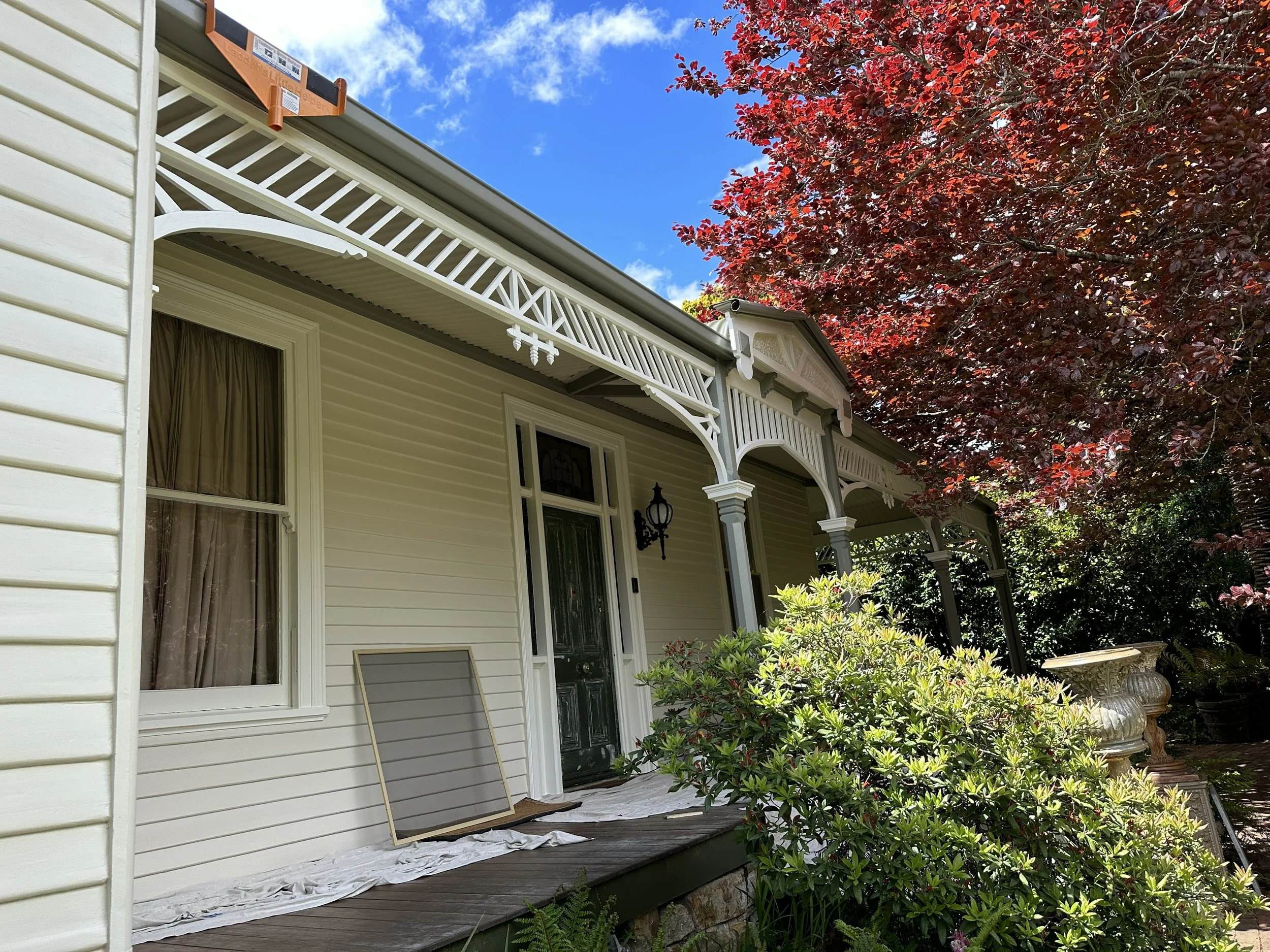 165‑year‑old front porch mid‑restoration showing timber repairs and preparation work.