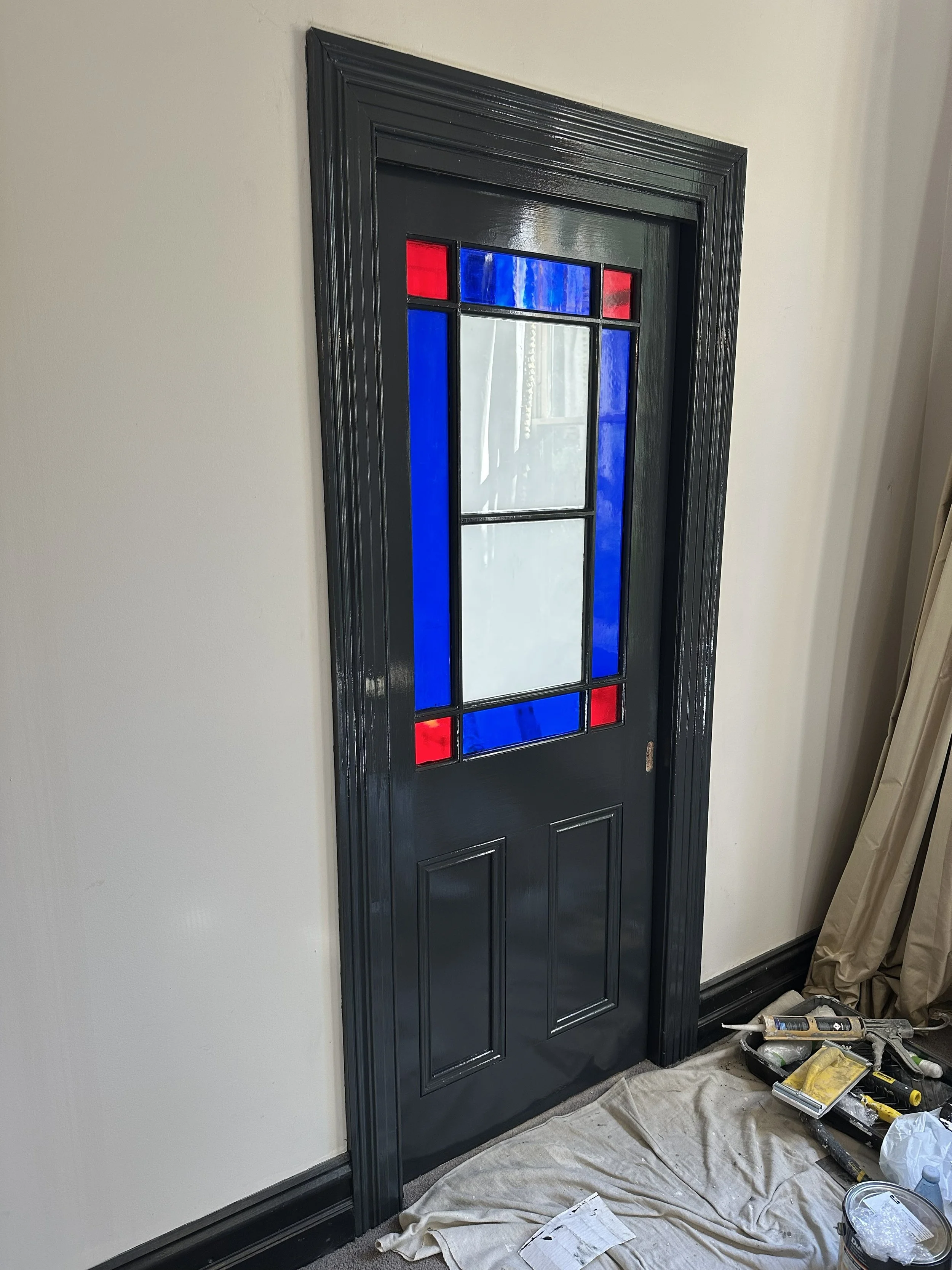 After photo showing restored sliding door with smooth gloss finish and repaired timber.