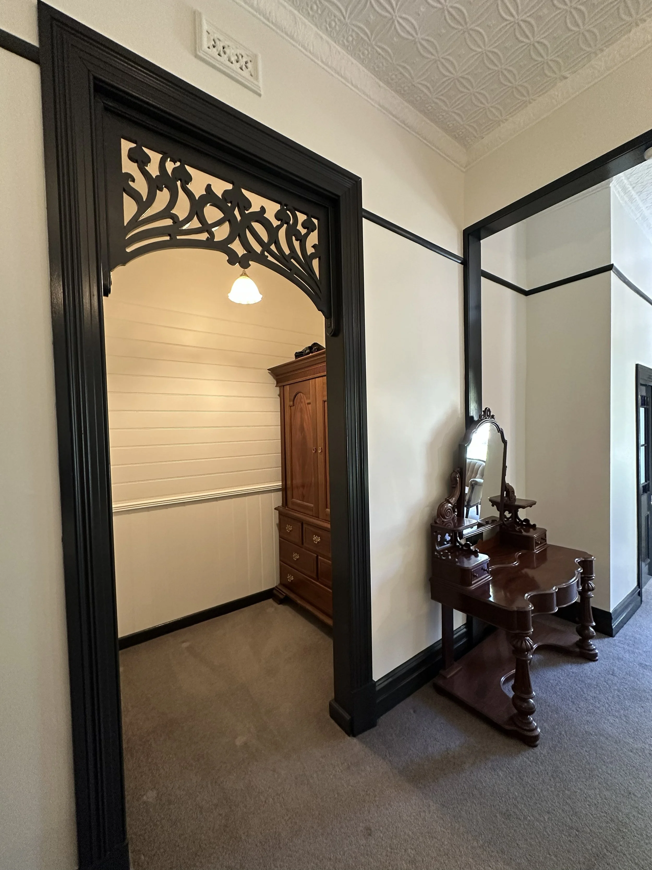 Victorian interior repaint with even coverage and restored skirting and architraves.