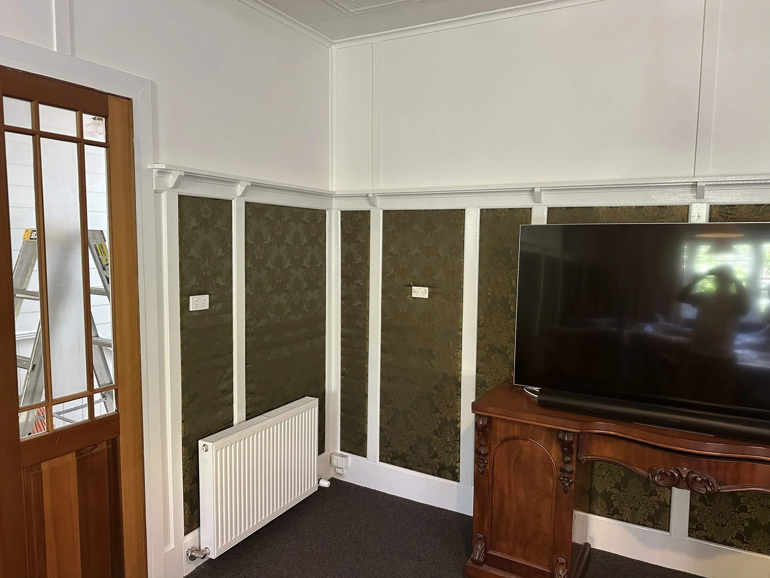 After photo of parlour room with restored timber trims and fresh interior repaint.