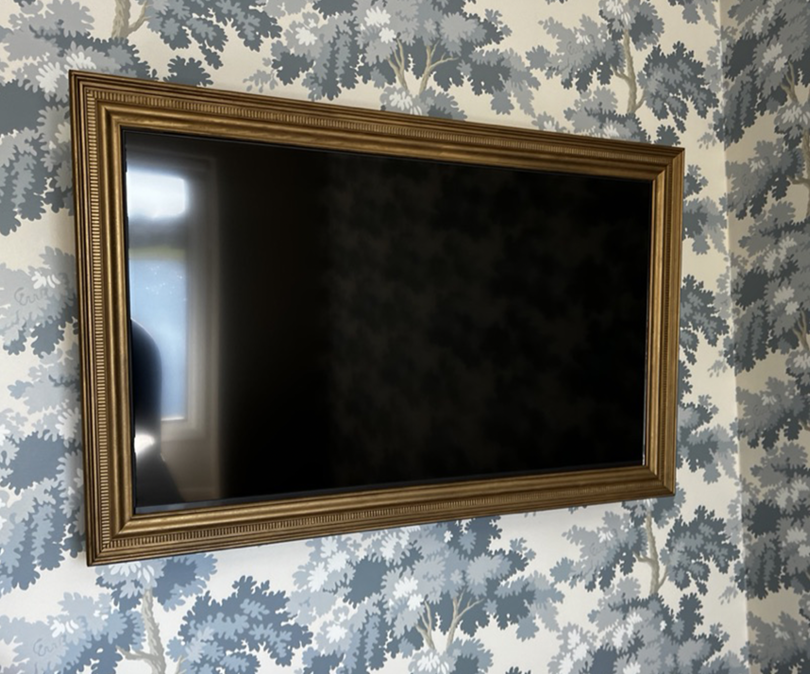 custom-made real wood antiqued vintage-look gold frame for the TV