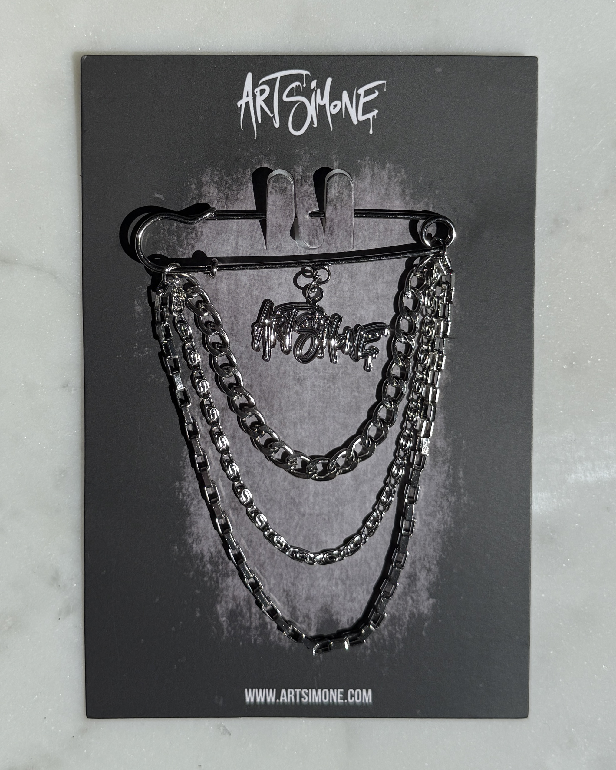 Art Simone 2026 Pin with backing card.png