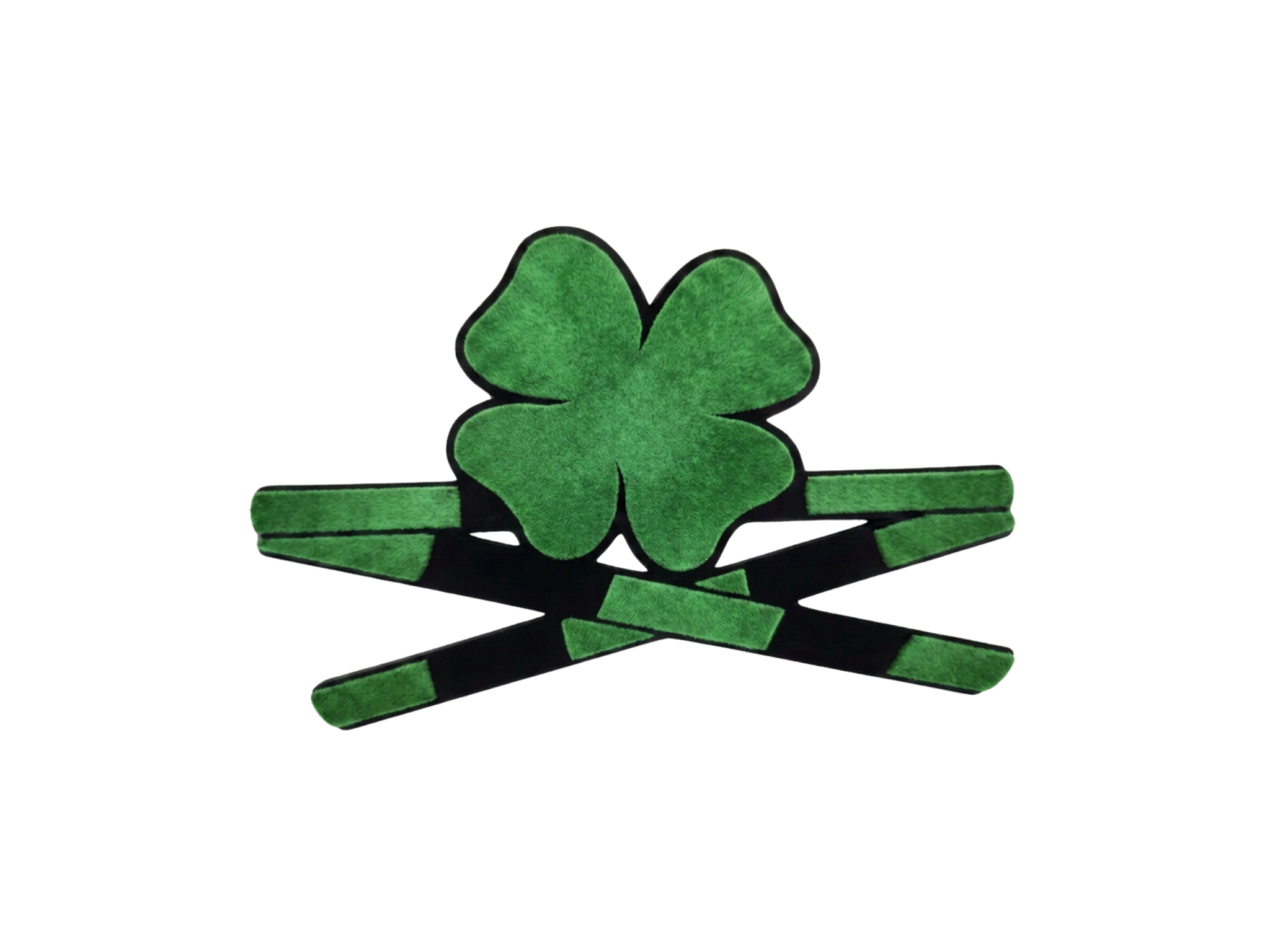 A green felt four-leaf clover decoration with black borders, surrounded by green and black striped elastic band pieces.