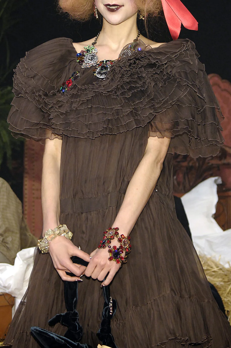 GALLIANO_F07_BROWNPLEATFRILLDRESS_CLOSEUP_RES150_CROP.jpg