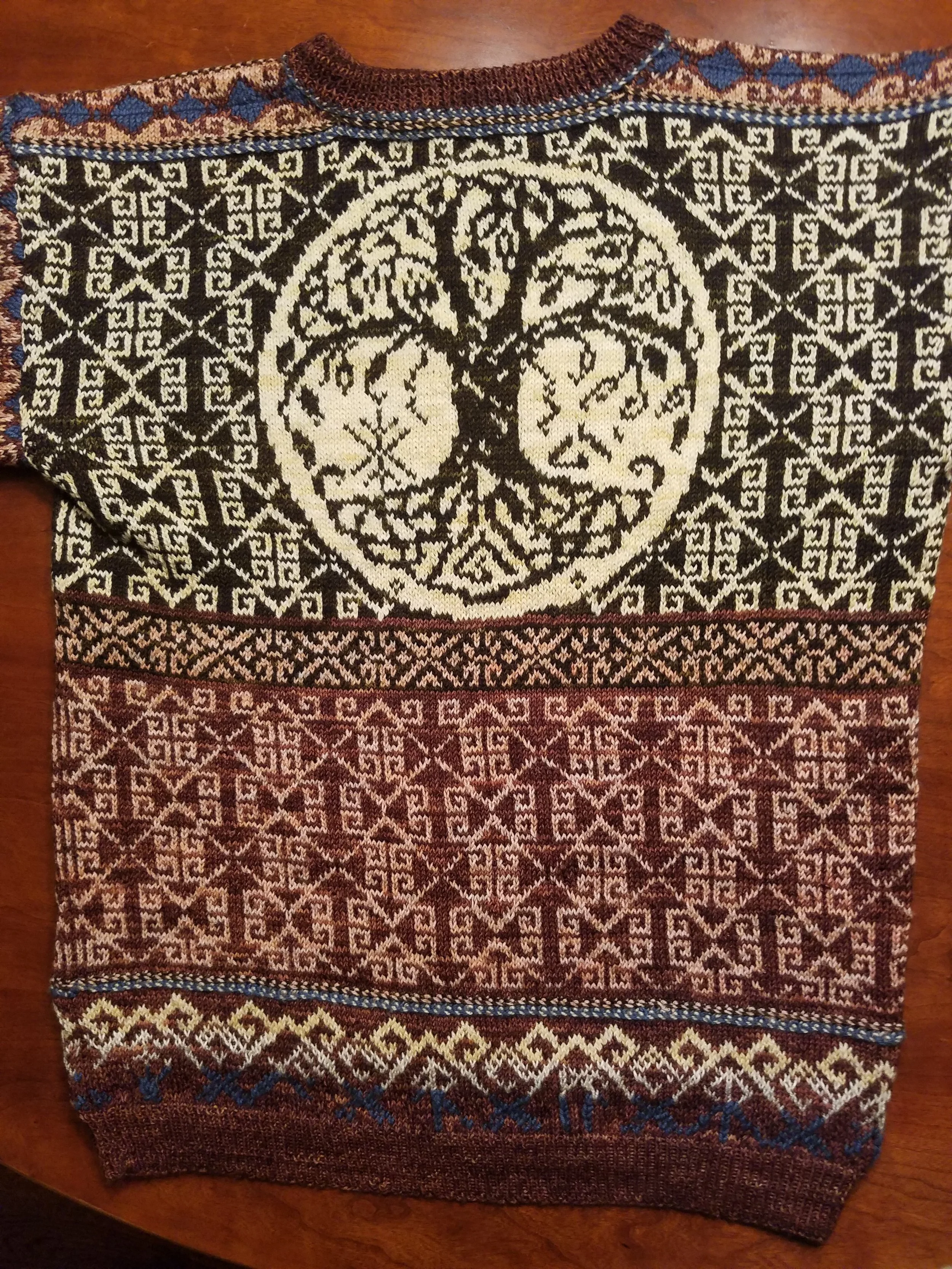 Annette Pascal makes the yarn come to life in this "Odin's Creatures" beauty designed by Cynthia Atley Peterson.  Features YarnSmith favorites Ivan, Marty, Anna Mae and Army Brown Black.