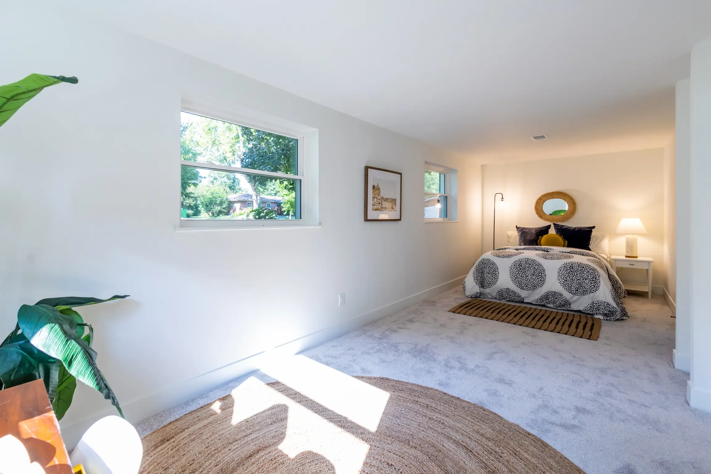 Upper Arlington bedroom featuring new carpet, drywall, windows and furnishings