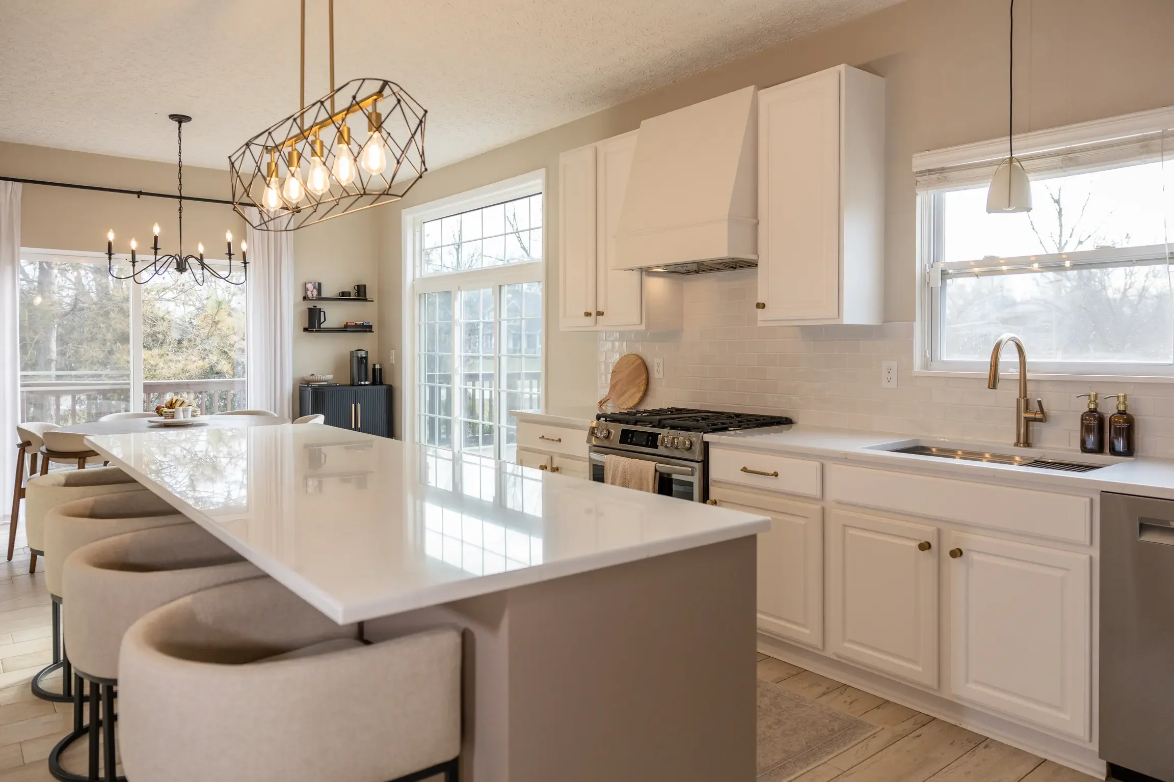White cabinets, subway tile, and new counters — a kitchen that feels completely updated without moving a wall.