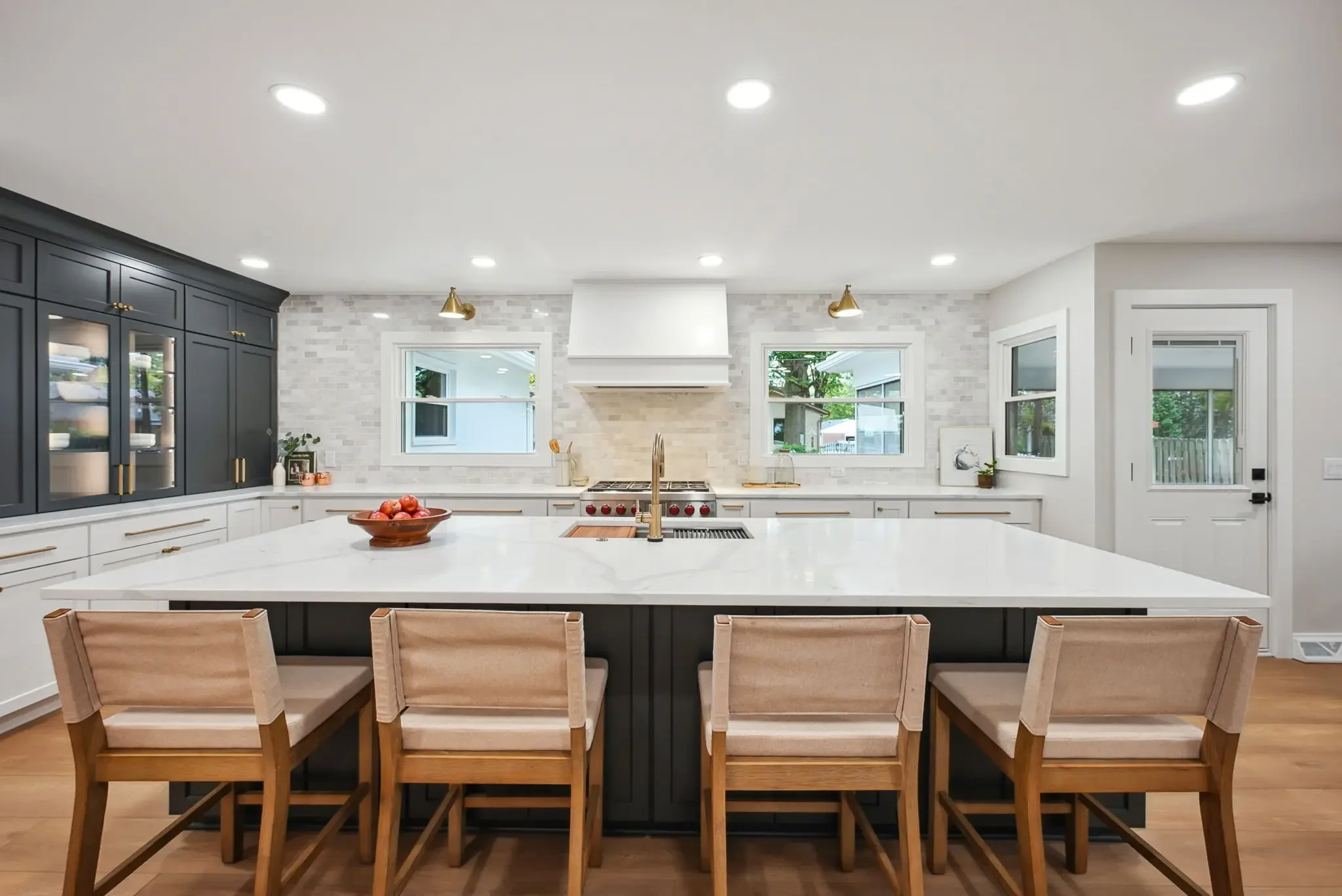 pper Arlington first floor kitchen remodel with dark cabinetry, white quartz island, and open-concept layout by Elevate Remodeling Columbus Ohio