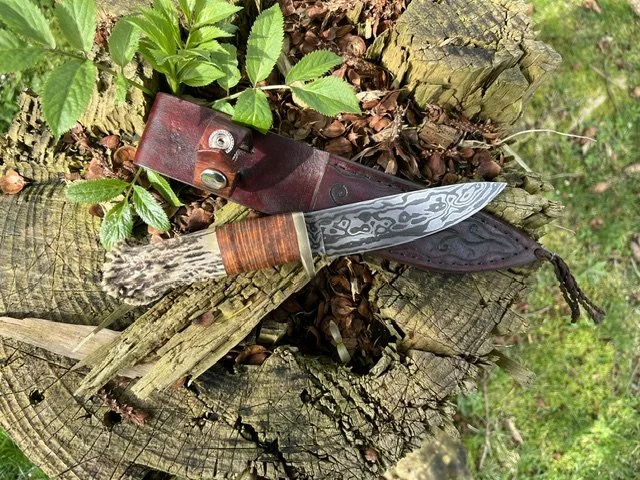 111. Damascus drop point hunter.
