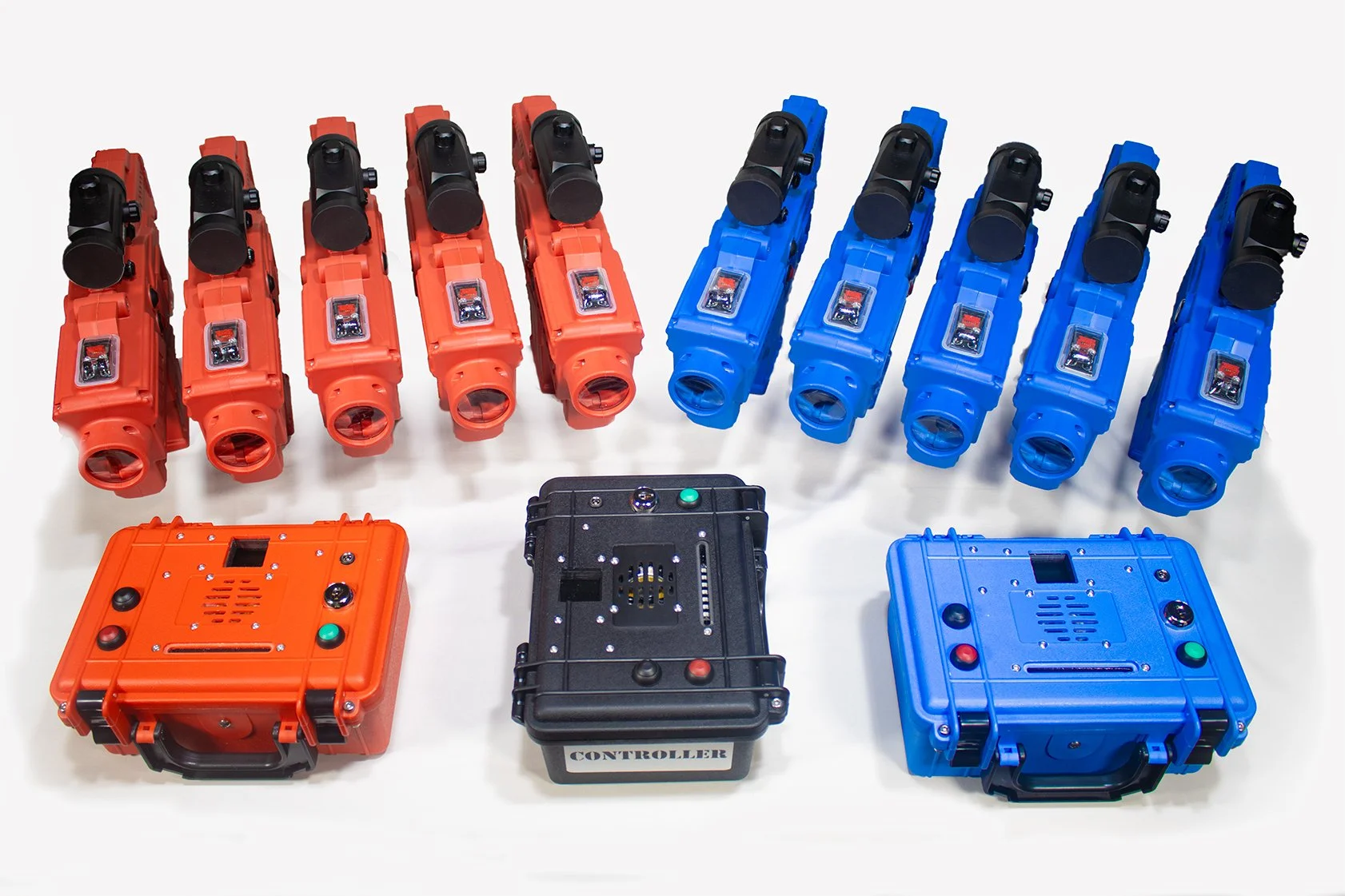 Multiple colorful robotic devices resembling laser tag guns and controllers arranged on a white surface.