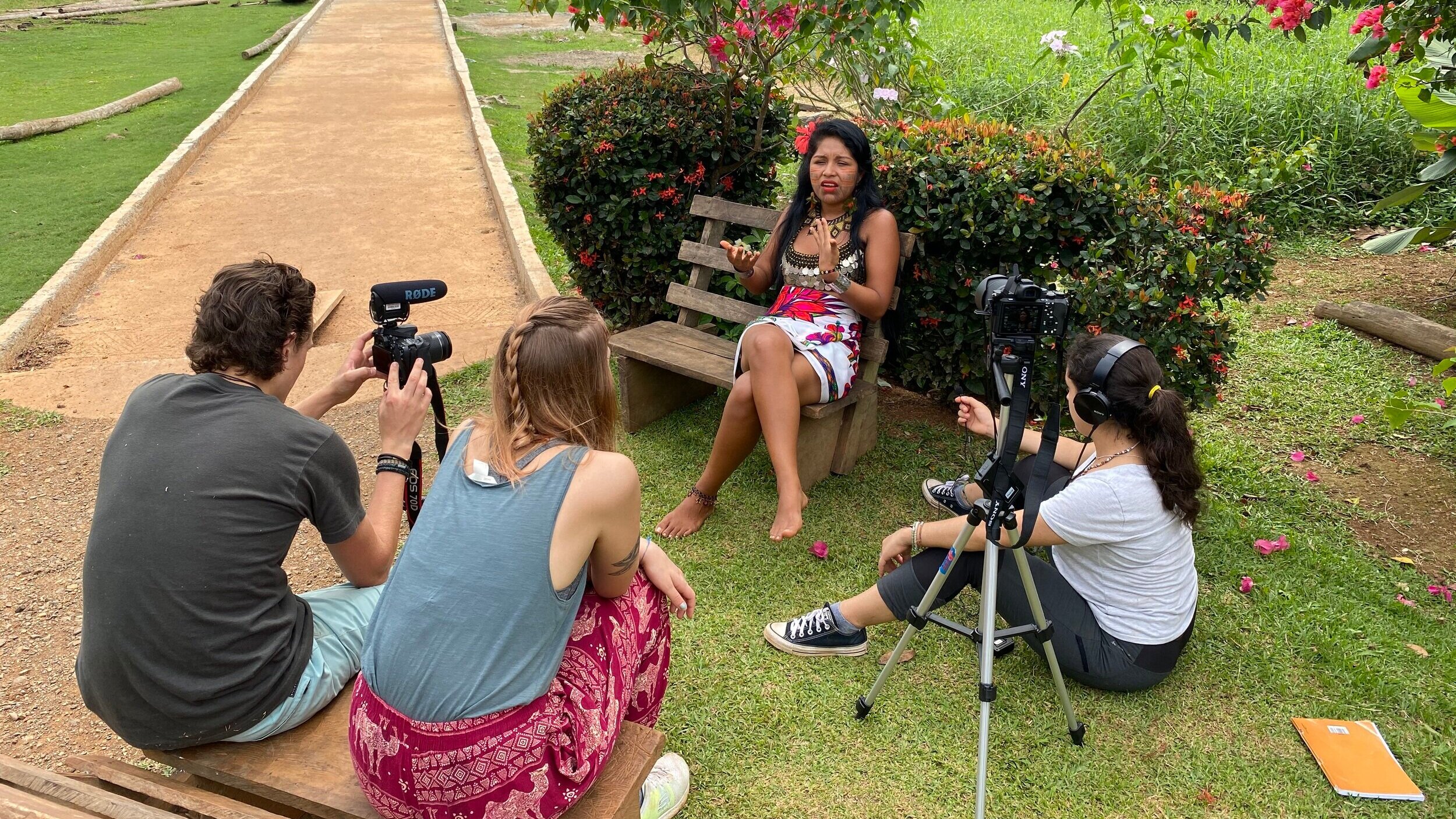 Jack%2C+Ievgeniia%2C+Embera+Quera+community+member%2C+Maria+Di+_+Embera+Quera+community%2C+Panama+_+filmmaking%2C+camera%2C+microphone%2C+interview%2C+bench%2C+path.jpg