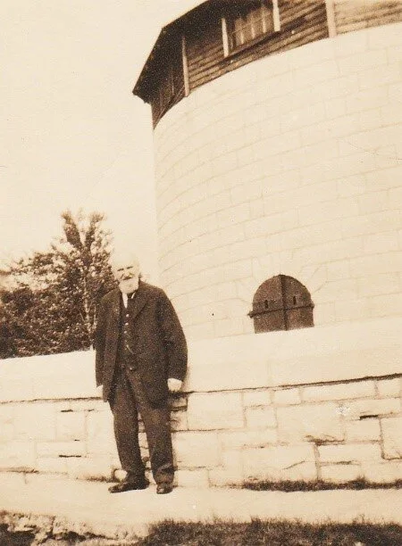 First Curator in Front of the Tower