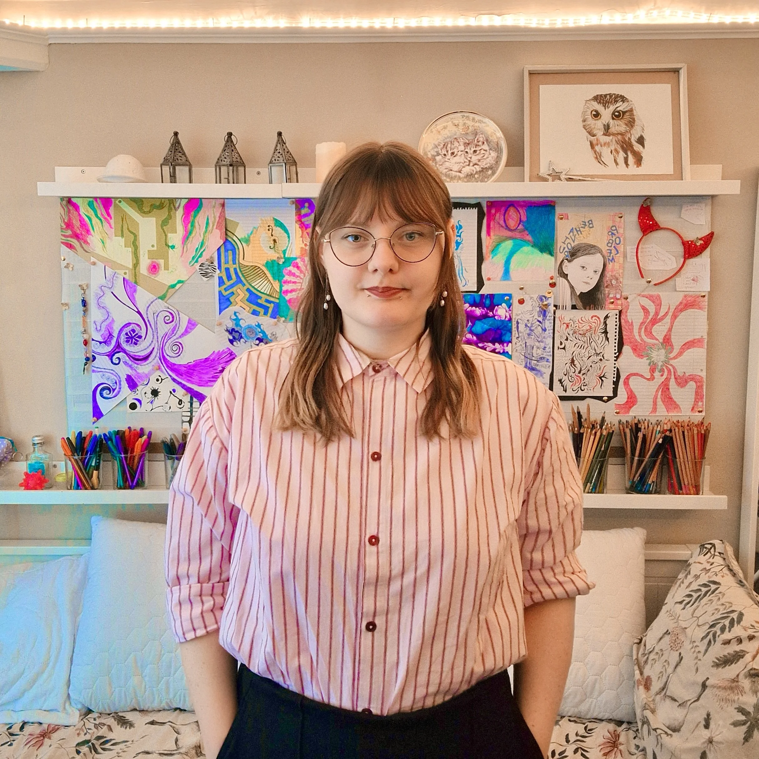 A photograph of Ennis Welbourne in their creative space