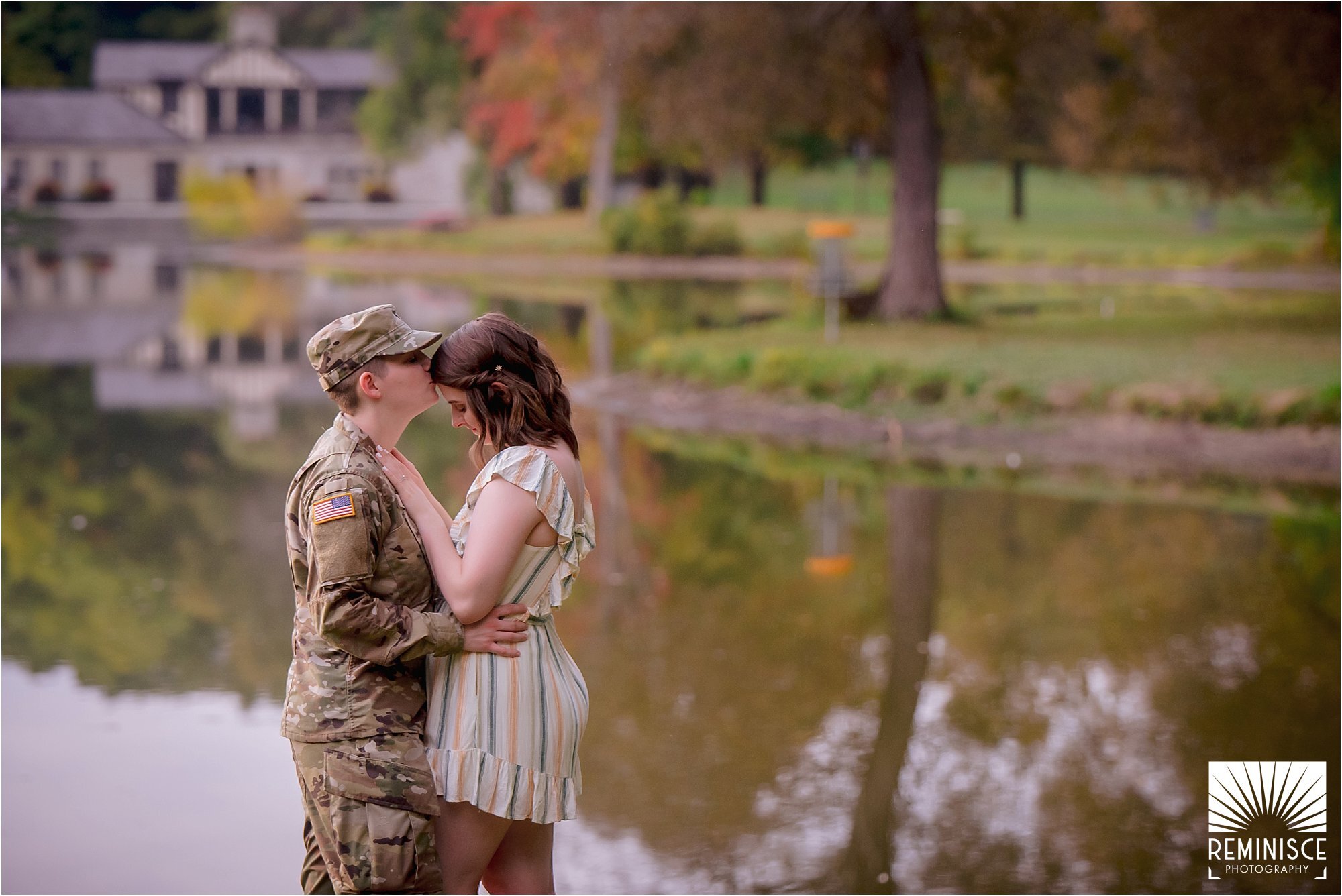 63-same-sex-engagement-photos-brown-deer-park-milwaukee-lgbtq-friendly-military-couple-kissing-forehead-reflection-pond.jpg