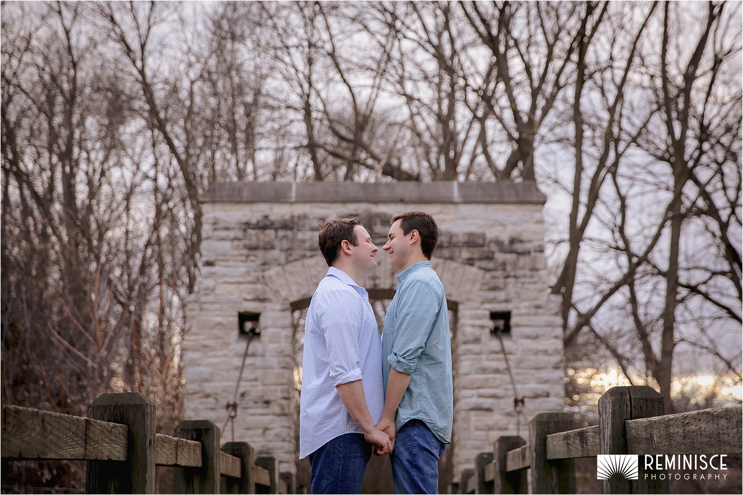 men-holding-hands-wooden-stone-bridge.JPG