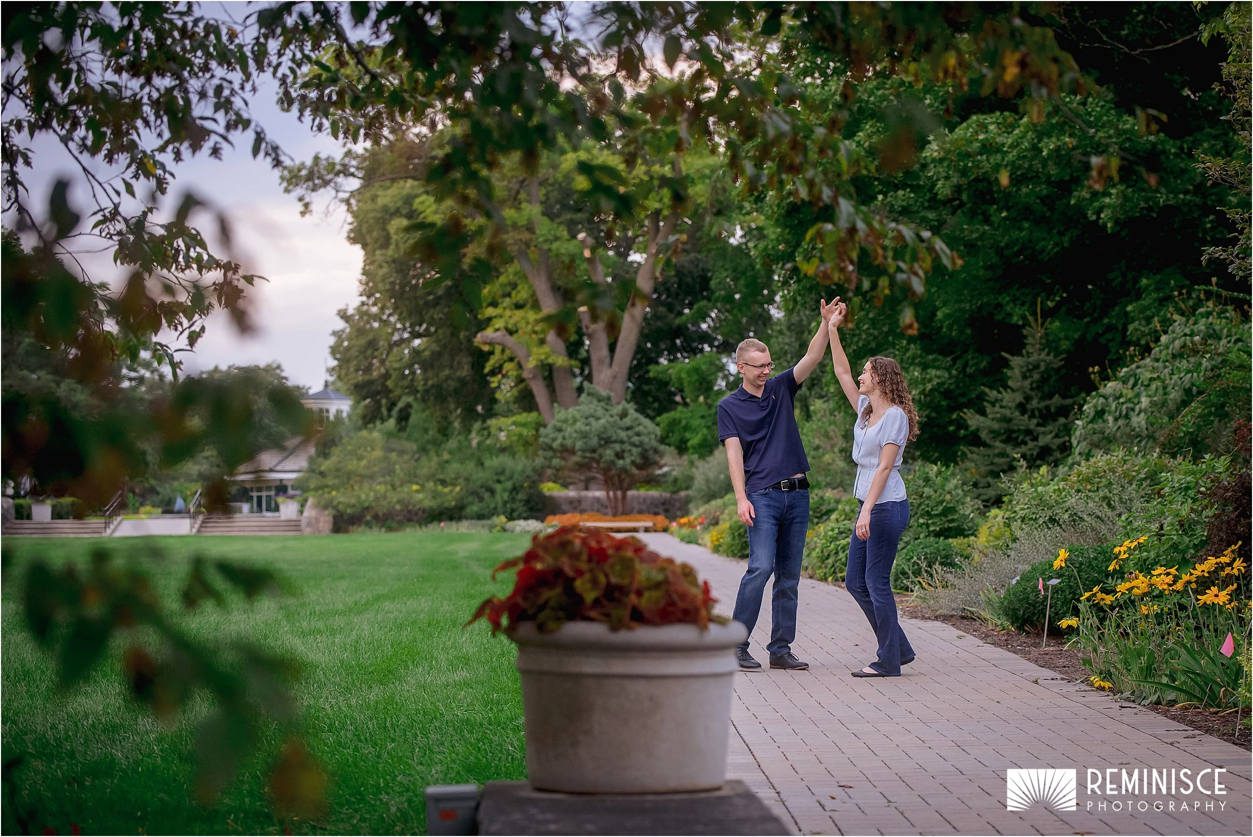 11-couple-twirlling-bricked-pathway-lush-greenery.JPG