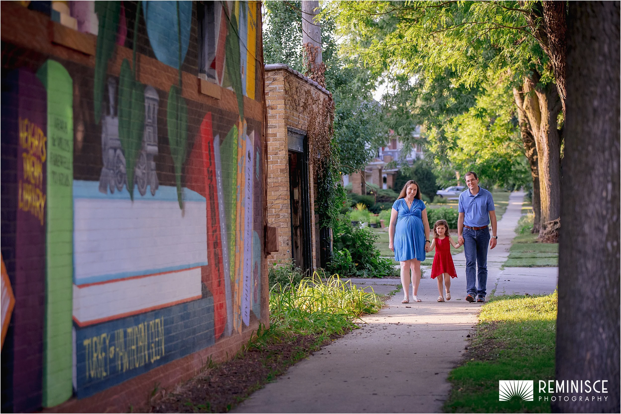 06-family-walking-girl-in-middle-down-sidewalk-golden-hour.JPG
