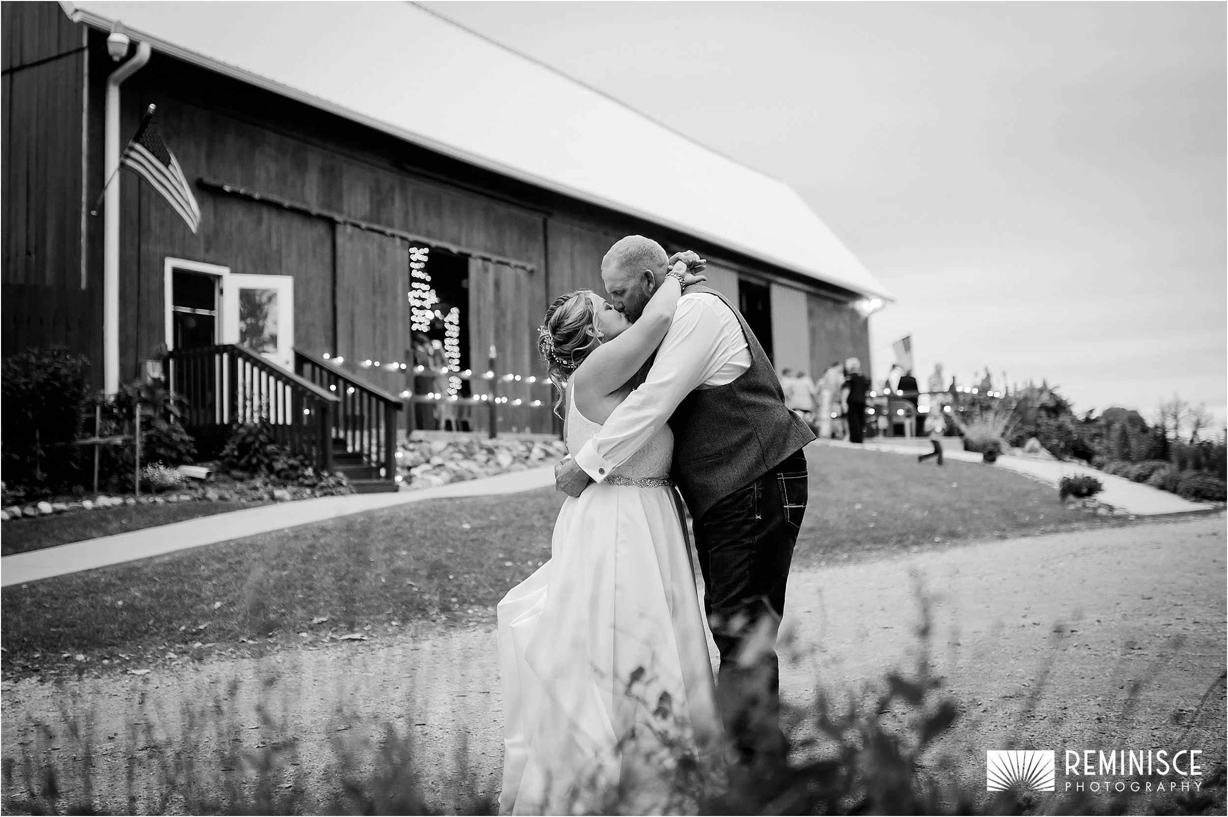 19-bride-groom-kissing-barn-background.JPG